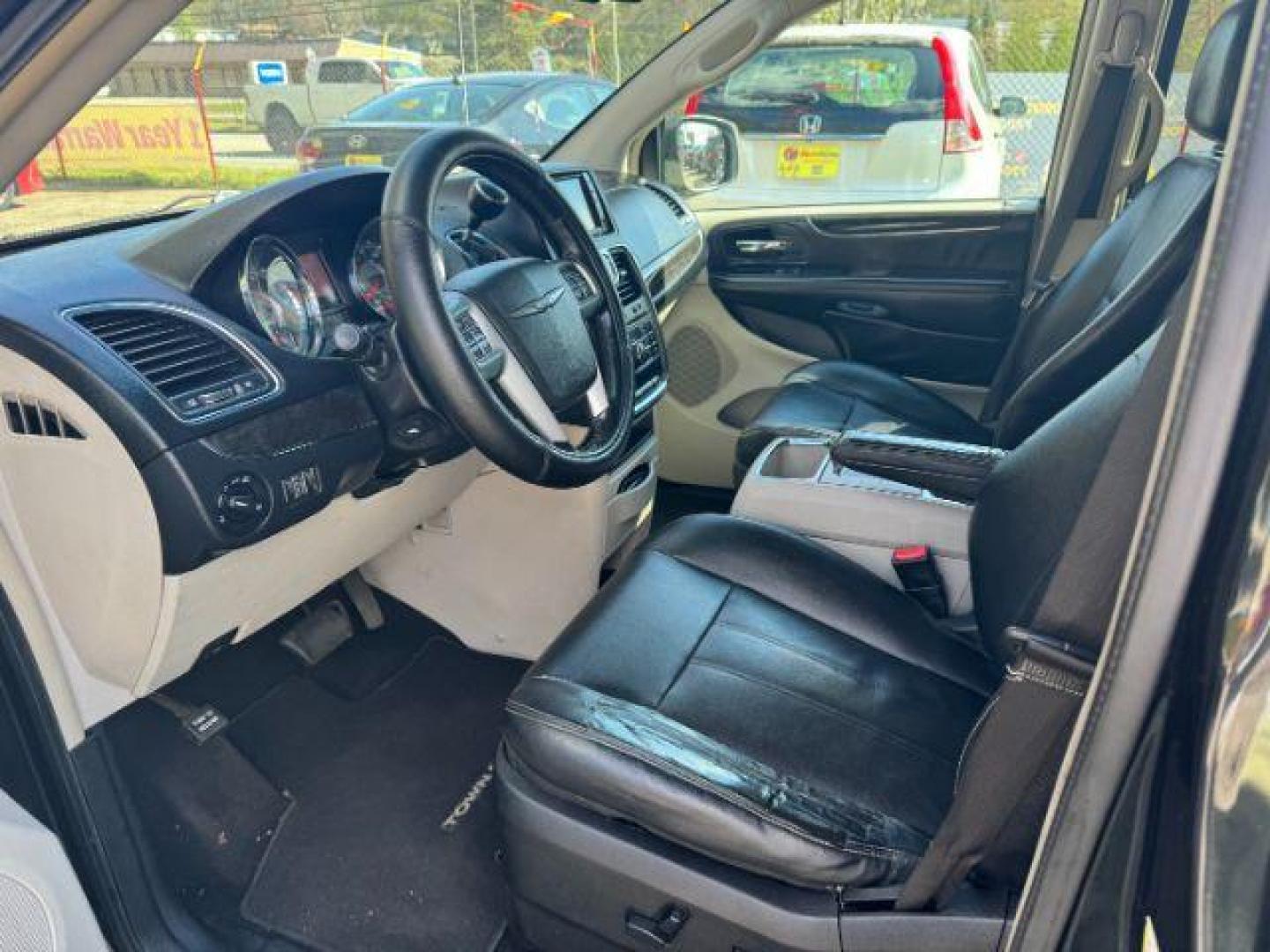 2012 Black Chrysler Town and Country Touring (2C4RC1BG3CR) with an 3.6L V6 DOHC 24V engine, 6-Speed Automatic transmission, located at 1806 Veterans Memorial Hwy SW, Austell, GA, 30168, (770) 944-9558, 33.817959, -84.606987 - Photo#4