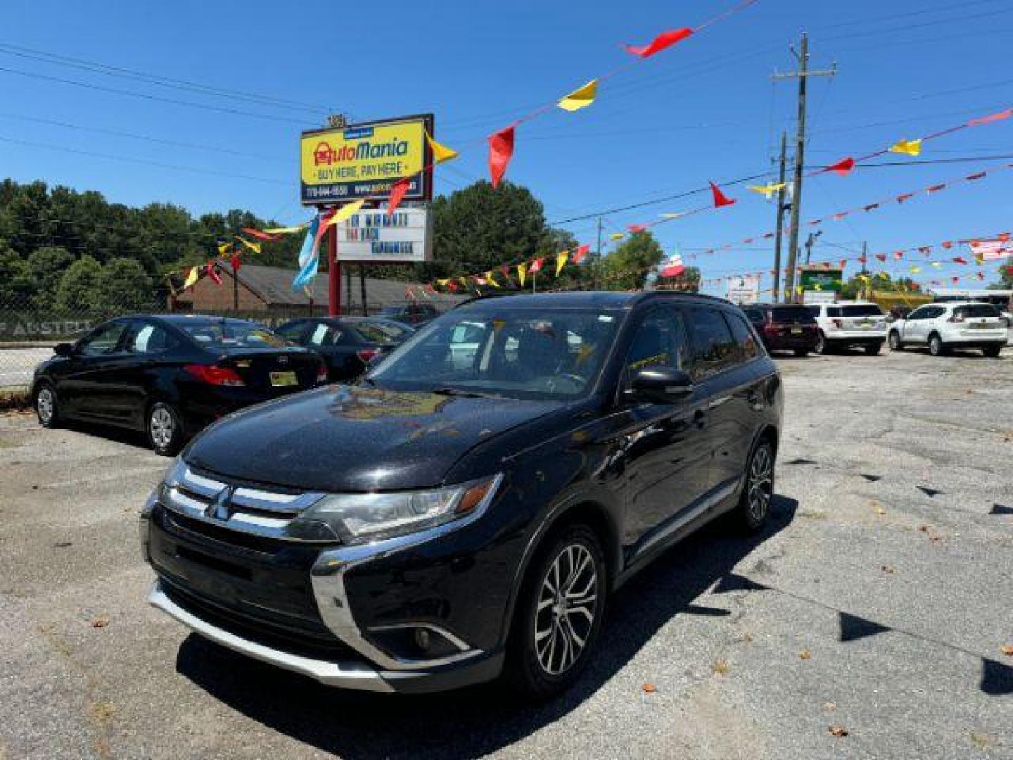 2016 Black Mitsubishi Outlander SEL 2WD (JA4AD3A31GZ) with an 2.4L L4 DOHC 16V engine, Continuously Variabl transmission, located at 1806 Veterans Memorial Hwy SW, Austell, GA, 30168, (770) 944-9558, 33.817959, -84.606987 - Photo#0