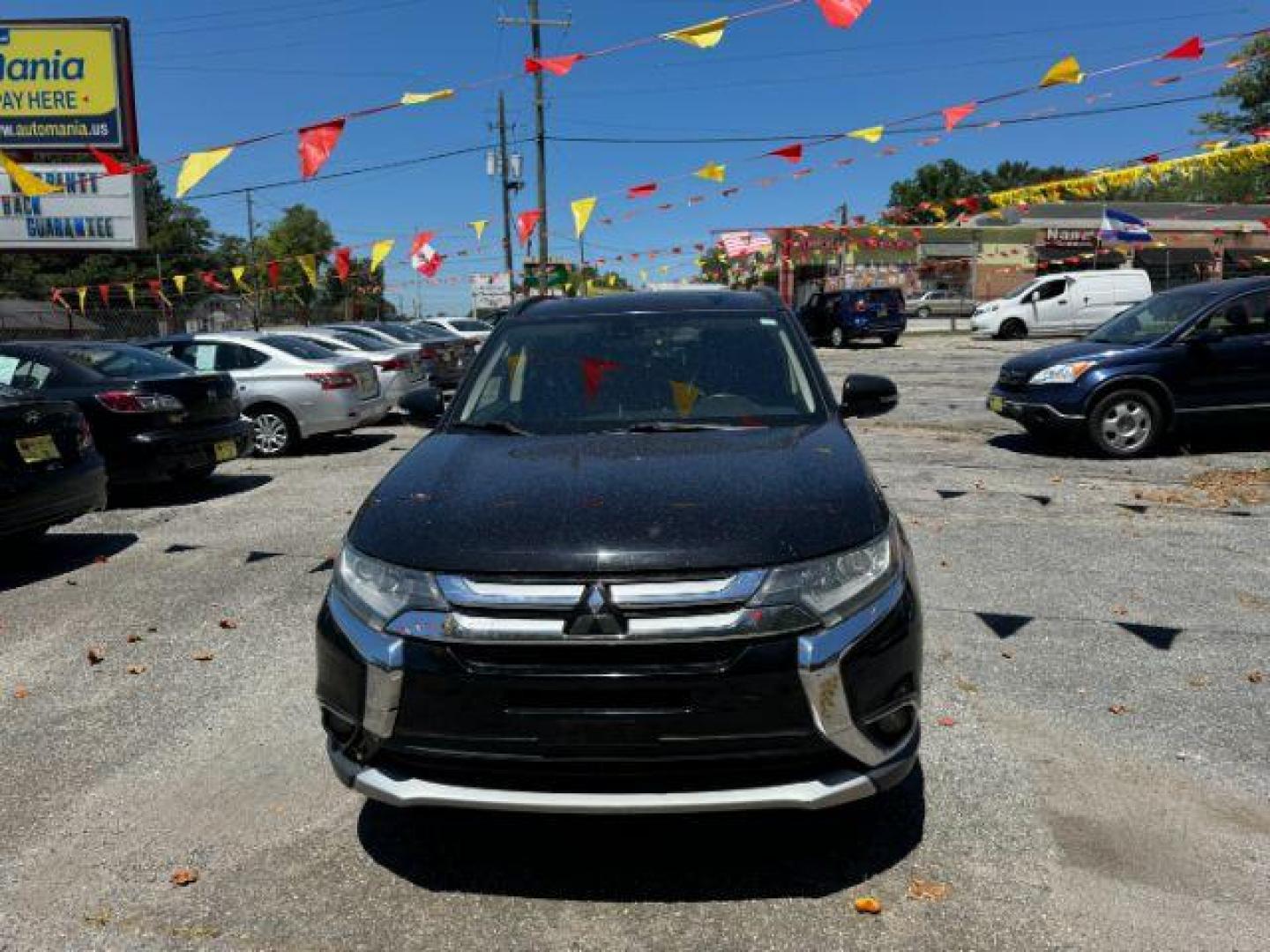 2016 Black Mitsubishi Outlander SEL 2WD (JA4AD3A31GZ) with an 2.4L L4 DOHC 16V engine, Continuously Variabl transmission, located at 1806 Veterans Memorial Hwy SW, Austell, GA, 30168, (770) 944-9558, 33.817959, -84.606987 - Photo#1