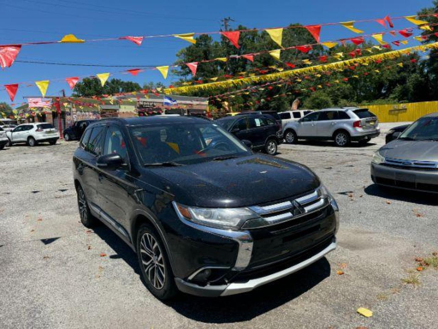 2016 Black Mitsubishi Outlander SEL 2WD (JA4AD3A31GZ) with an 2.4L L4 DOHC 16V engine, Continuously Variabl transmission, located at 1806 Veterans Memorial Hwy SW, Austell, GA, 30168, (770) 944-9558, 33.817959, -84.606987 - Photo#2