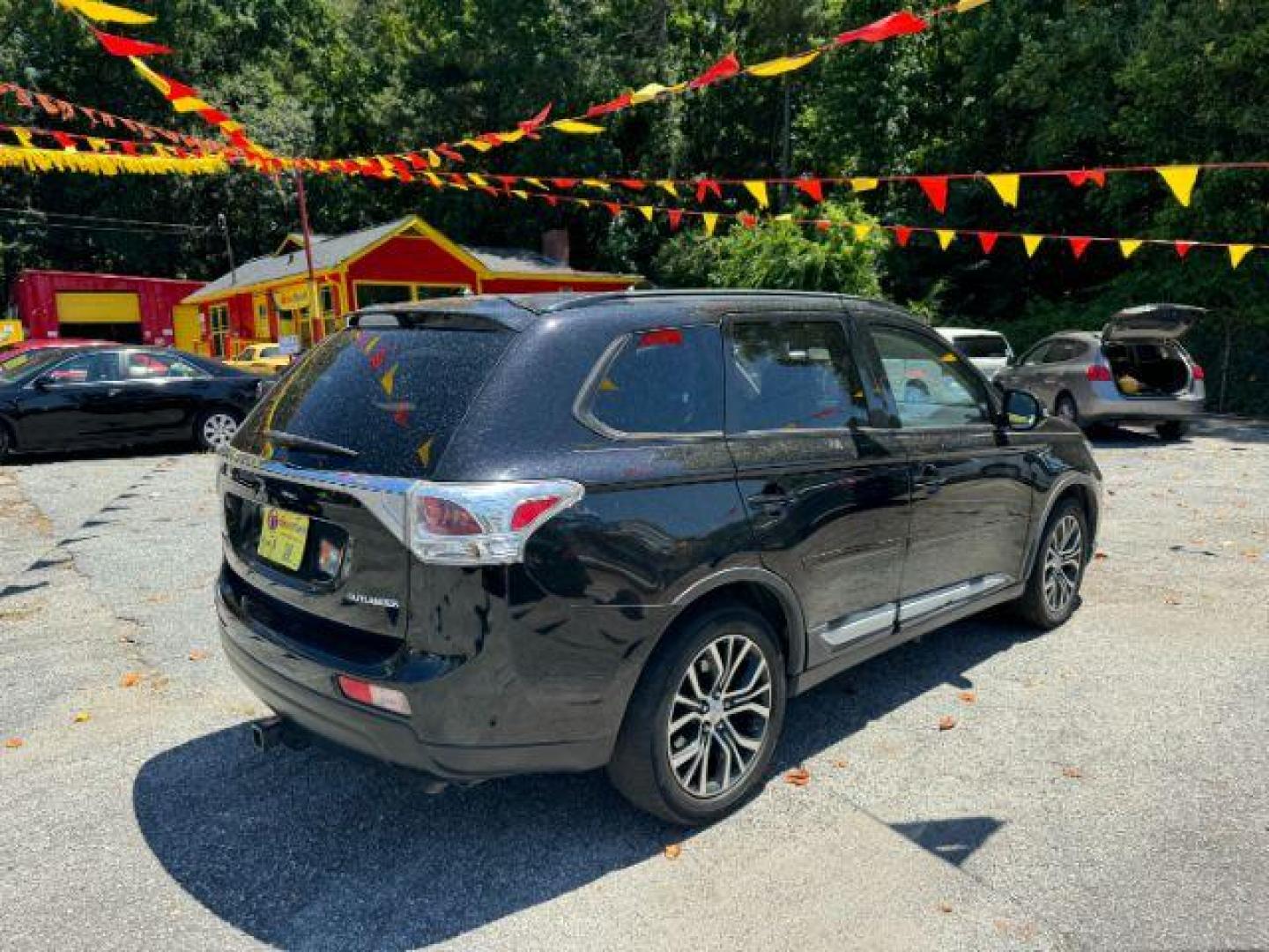 2016 Black Mitsubishi Outlander SEL 2WD (JA4AD3A31GZ) with an 2.4L L4 DOHC 16V engine, Continuously Variabl transmission, located at 1806 Veterans Memorial Hwy SW, Austell, GA, 30168, (770) 944-9558, 33.817959, -84.606987 - Photo#3