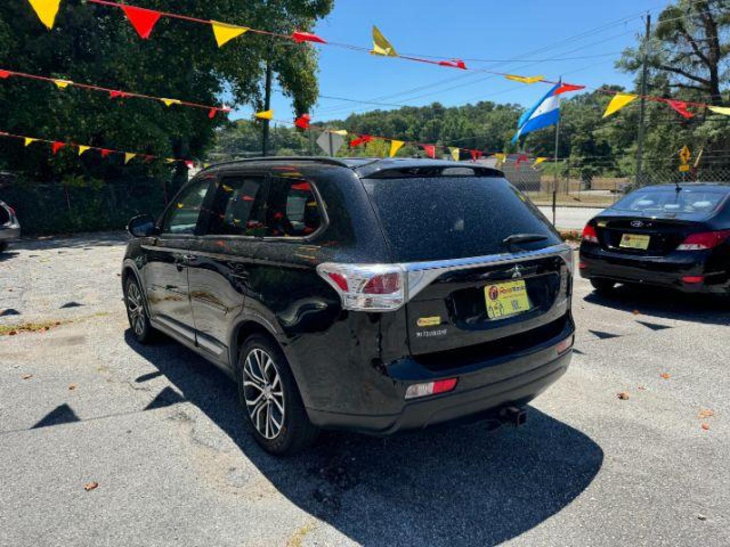 2016 Black Mitsubishi Outlander SEL 2WD (JA4AD3A31GZ) with an 2.4L L4 DOHC 16V engine, Continuously Variabl transmission, located at 1806 Veterans Memorial Hwy SW, Austell, GA, 30168, (770) 944-9558, 33.817959, -84.606987 - Photo#5