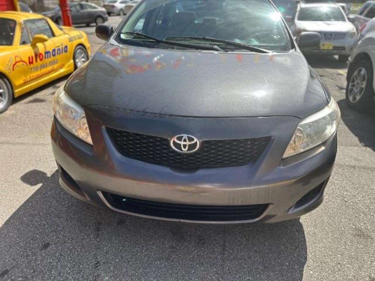 2009 Gray Toyota Corolla LE 4-Speed AT (JTDBL40E39J) with an 1.8L L4 DOHC 16V engine, 4-Speed Automatic transmission, located at 1806 Veterans Memorial Hwy SW, Austell, GA, 30168, (770) 944-9558, 33.817959, -84.606987 - Photo#1
