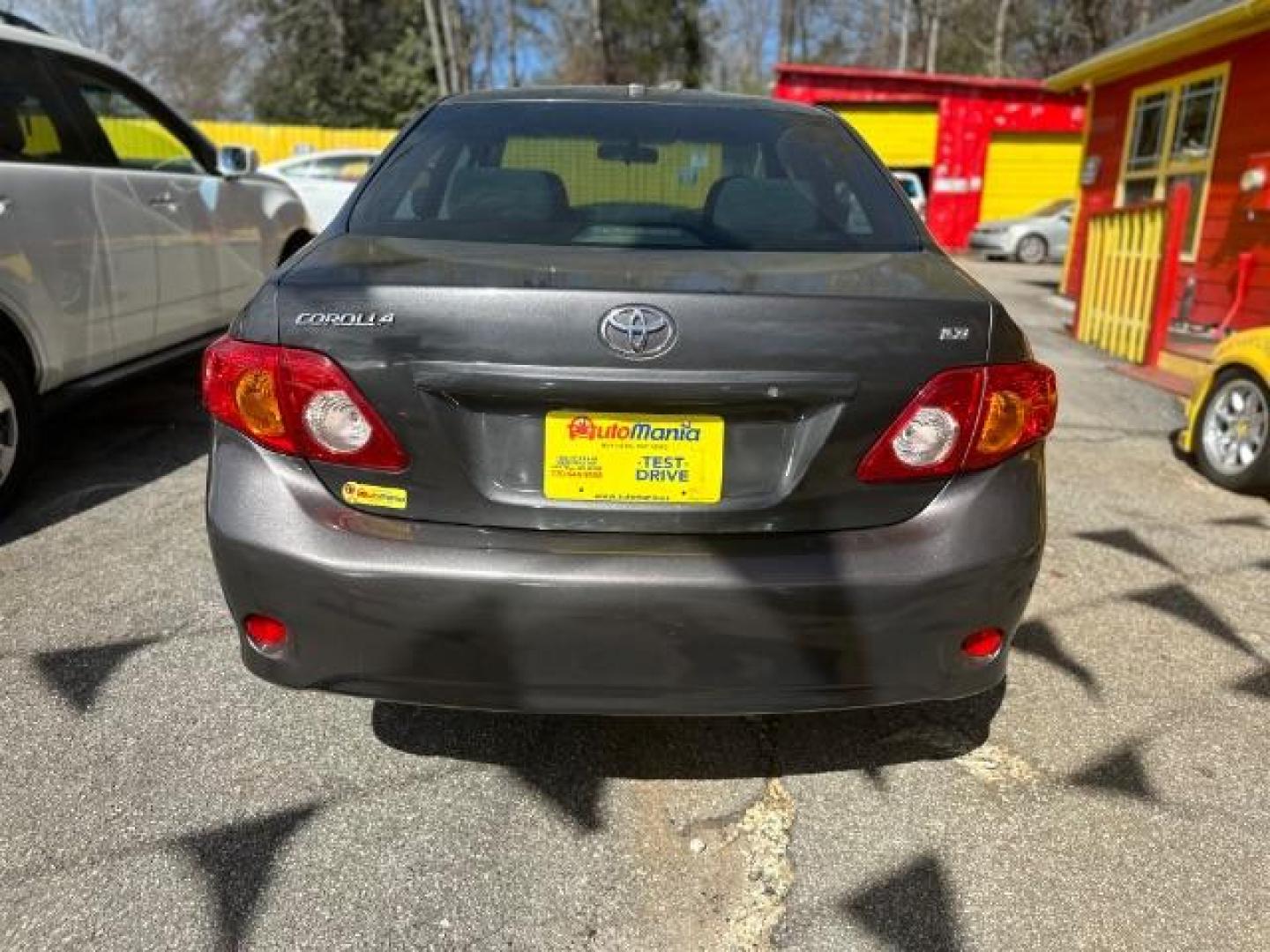 2009 Gray Toyota Corolla LE 4-Speed AT (JTDBL40E39J) with an 1.8L L4 DOHC 16V engine, 4-Speed Automatic transmission, located at 1806 Veterans Memorial Hwy SW, Austell, GA, 30168, (770) 944-9558, 33.817959, -84.606987 - Photo#4