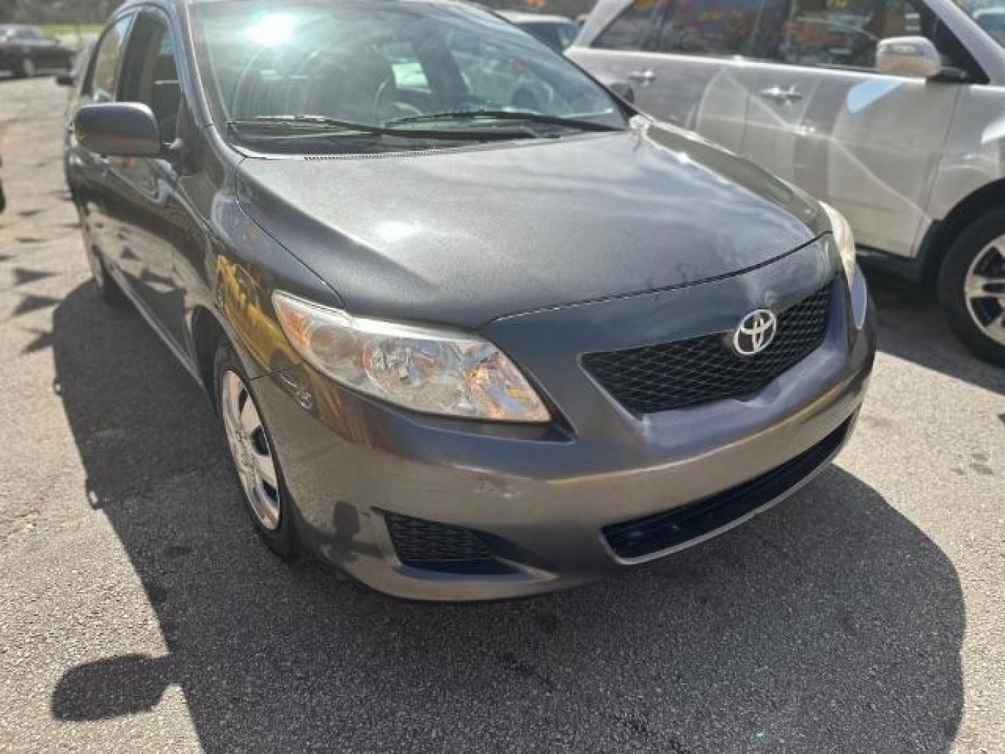 2009 Gray Toyota Corolla LE 4-Speed AT (JTDBL40E39J) with an 1.8L L4 DOHC 16V engine, 4-Speed Automatic transmission, located at 1806 Veterans Memorial Hwy SW, Austell, GA, 30168, (770) 944-9558, 33.817959, -84.606987 - Photo#2