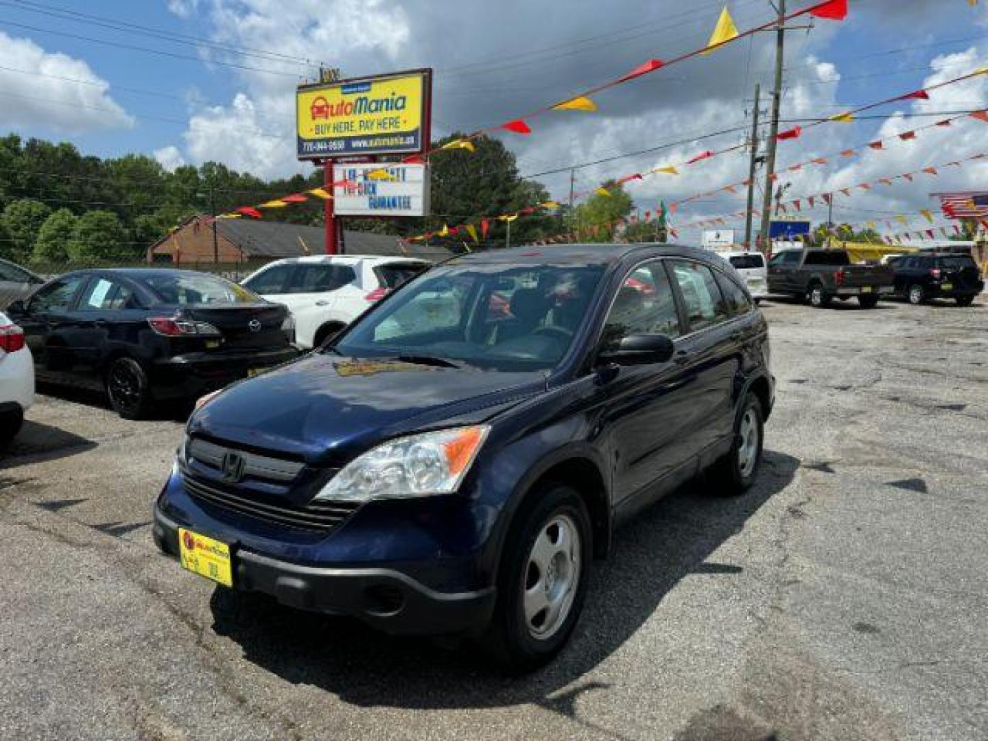 2009 Blue Honda CR-V LX 2WD 5-Speed AT (JHLRE38399C) with an 2.4L L4 DOHC 16V engine, 5-Speed Automatic transmission, located at 1806 Veterans Memorial Hwy SW, Austell, GA, 30168, (770) 944-9558, 33.817959, -84.606987 - Photo#0