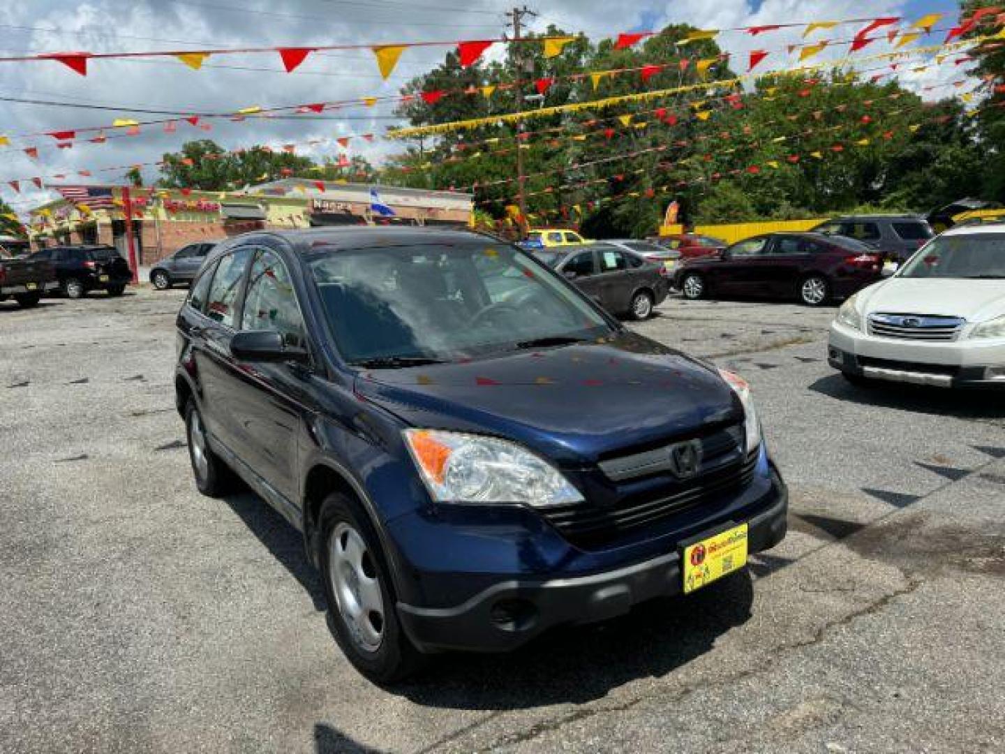 2009 Blue Honda CR-V LX 2WD 5-Speed AT (JHLRE38399C) with an 2.4L L4 DOHC 16V engine, 5-Speed Automatic transmission, located at 1806 Veterans Memorial Hwy SW, Austell, GA, 30168, (770) 944-9558, 33.817959, -84.606987 - Photo#2