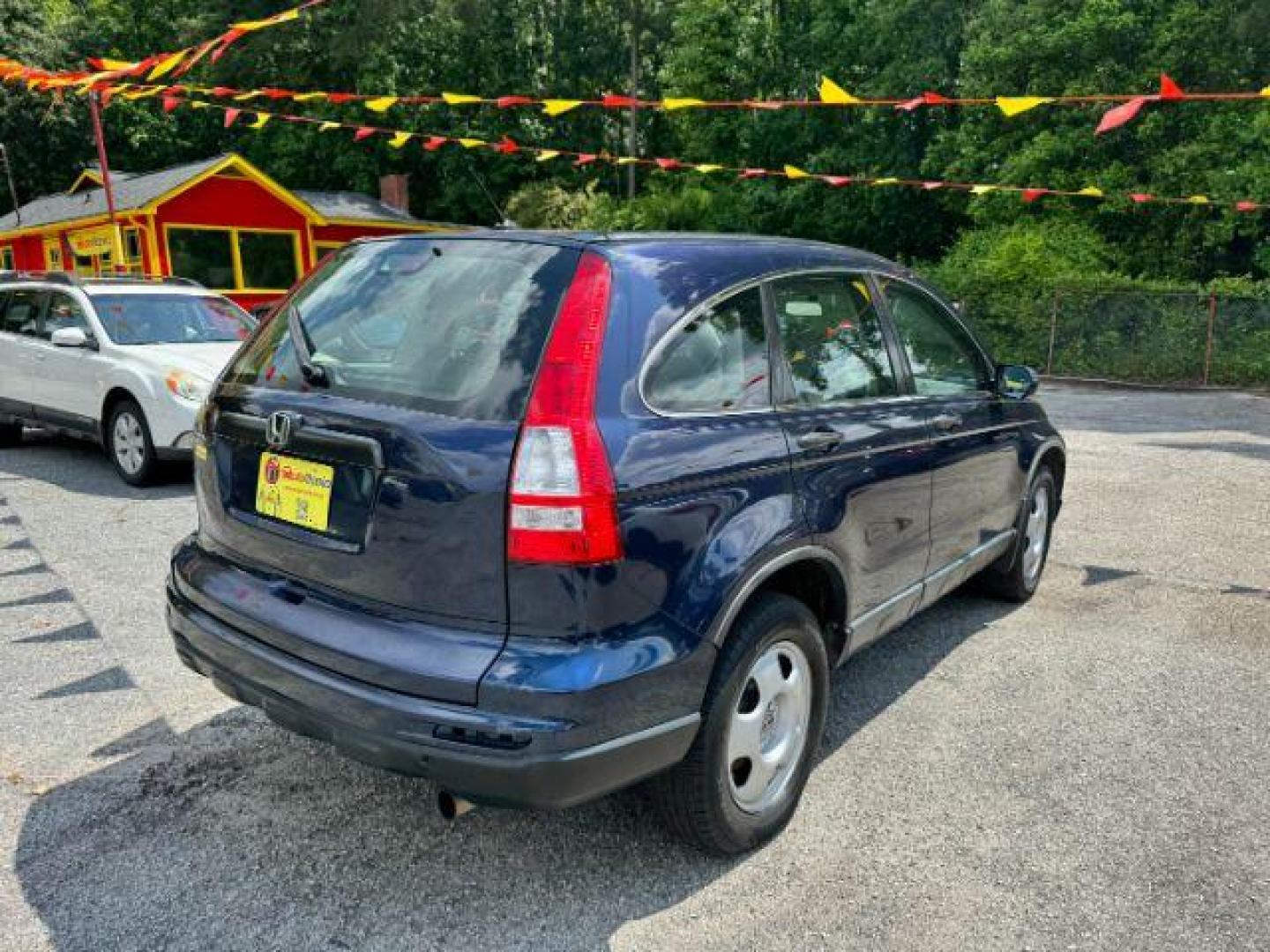 2009 Blue Honda CR-V LX 2WD 5-Speed AT (JHLRE38399C) with an 2.4L L4 DOHC 16V engine, 5-Speed Automatic transmission, located at 1806 Veterans Memorial Hwy SW, Austell, GA, 30168, (770) 944-9558, 33.817959, -84.606987 - Photo#3