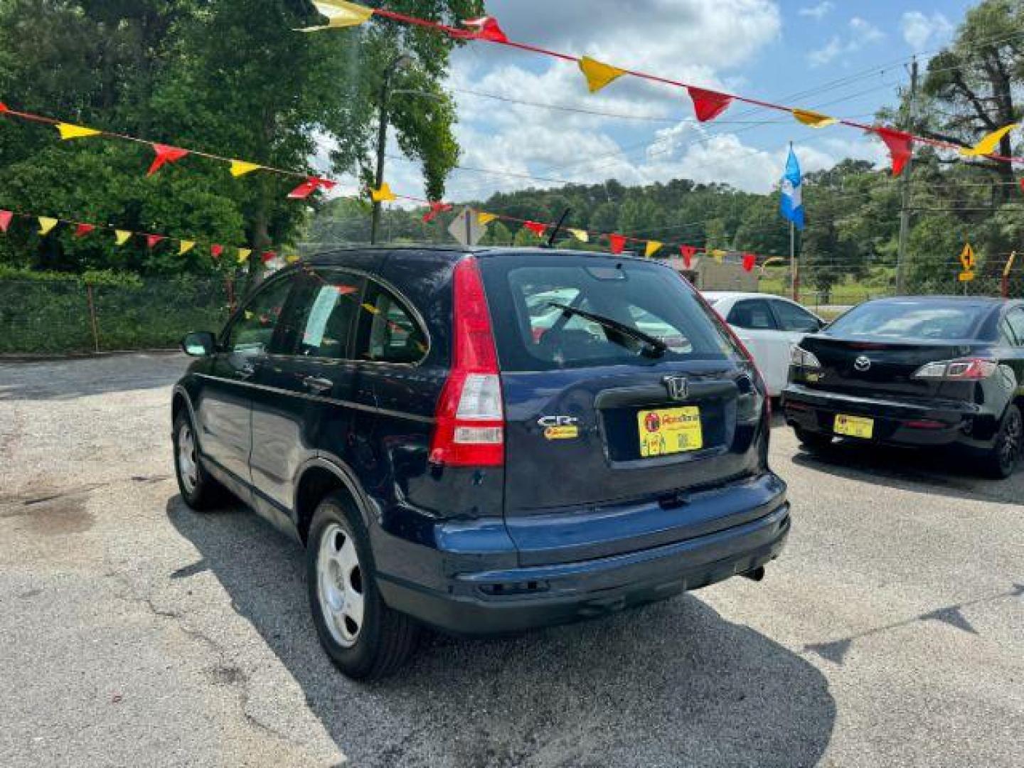 2009 Blue Honda CR-V LX 2WD 5-Speed AT (JHLRE38399C) with an 2.4L L4 DOHC 16V engine, 5-Speed Automatic transmission, located at 1806 Veterans Memorial Hwy SW, Austell, GA, 30168, (770) 944-9558, 33.817959, -84.606987 - Photo#5