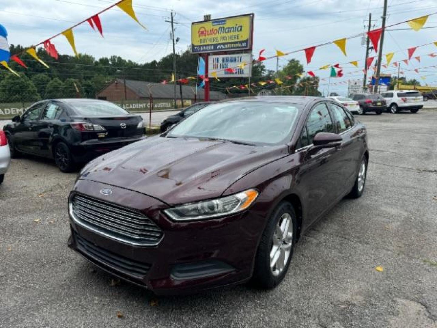 2013 Burgundy Ford Fusion SE (3FA6P0HRXDR) with an 1.6L L4 DOHC 16V engine, 5-Speed Automatic transmission, located at 1806 Veterans Memorial Hwy SW, Austell, GA, 30168, (770) 944-9558, 33.817959, -84.606987 - Photo#0