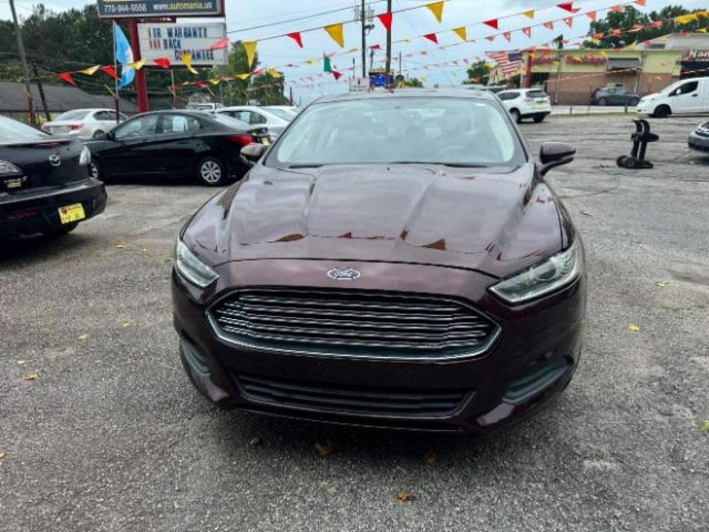 2013 Burgundy Ford Fusion SE (3FA6P0HRXDR) with an 1.6L L4 DOHC 16V engine, 5-Speed Automatic transmission, located at 1806 Veterans Memorial Hwy SW, Austell, GA, 30168, (770) 944-9558, 33.817959, -84.606987 - Photo#1