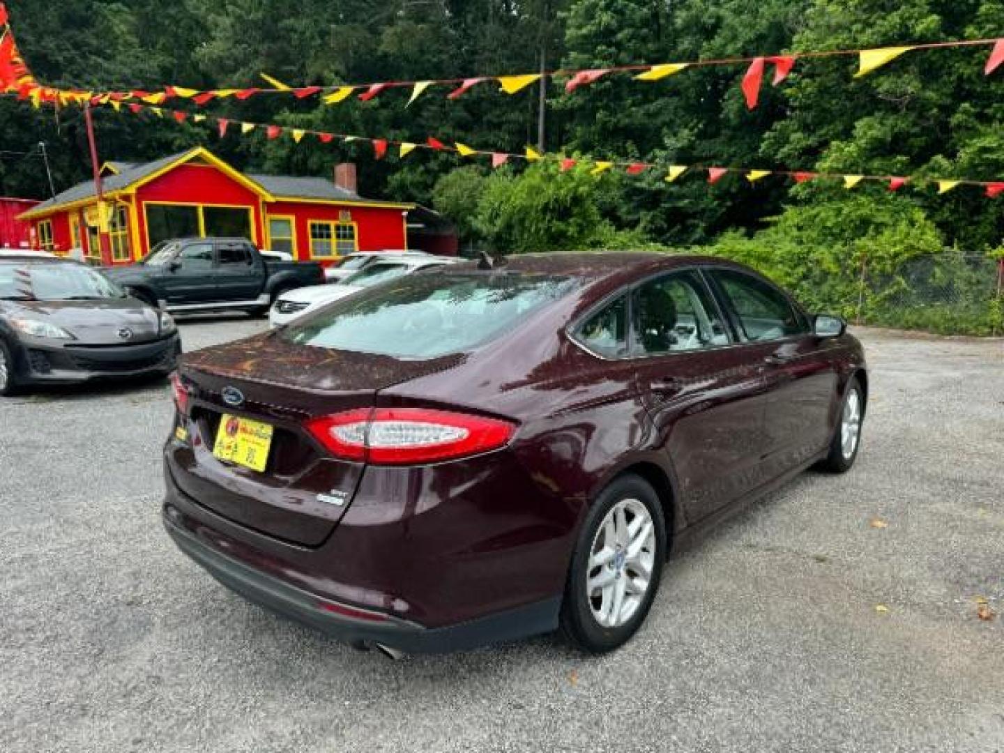 2013 Burgundy Ford Fusion SE (3FA6P0HRXDR) with an 1.6L L4 DOHC 16V engine, 5-Speed Automatic transmission, located at 1806 Veterans Memorial Hwy SW, Austell, GA, 30168, (770) 944-9558, 33.817959, -84.606987 - Photo#3