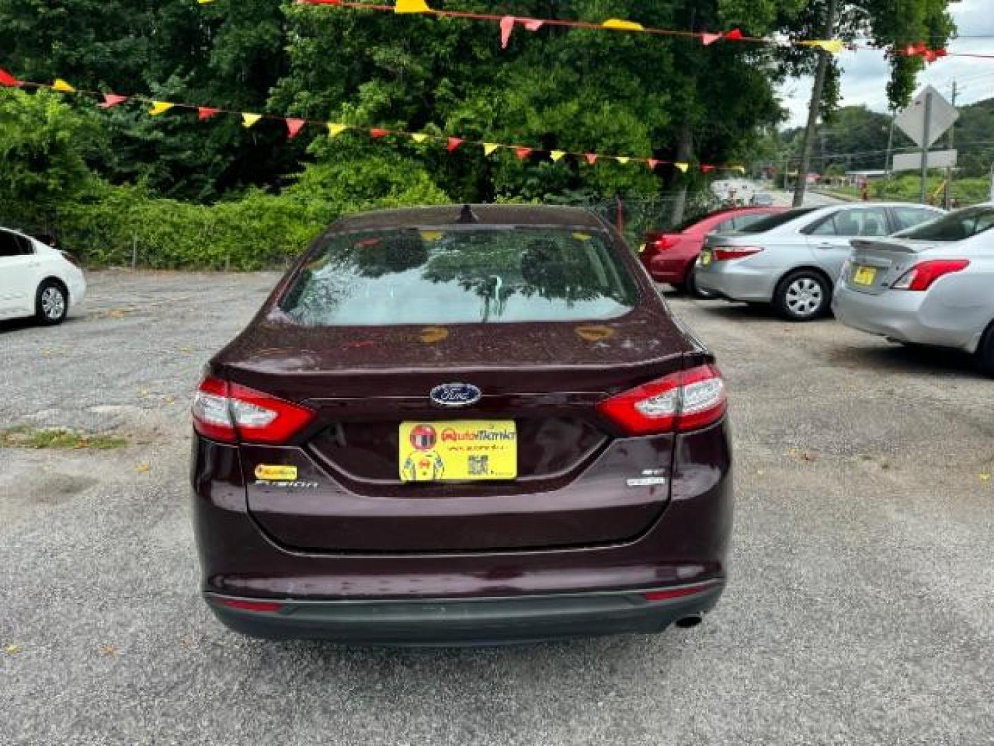 2013 Burgundy Ford Fusion SE (3FA6P0HRXDR) with an 1.6L L4 DOHC 16V engine, 5-Speed Automatic transmission, located at 1806 Veterans Memorial Hwy SW, Austell, GA, 30168, (770) 944-9558, 33.817959, -84.606987 - Photo#4