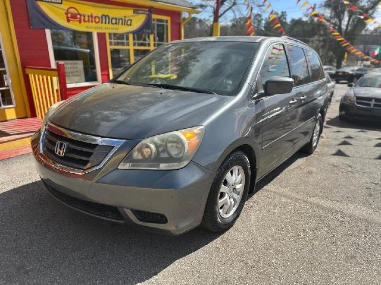 2010 Gray Honda Odyssey EX-L w/ DVD (5FNRL3H78AB) with an 3.5L V6 SOHC 24V engine, 5-Speed Automatic transmission, located at 1806 Veterans Memorial Hwy SW, Austell, GA, 30168, (770) 944-9558, 33.817959, -84.606987 - Photo#0