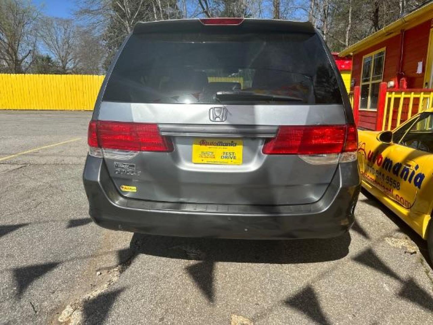 2010 Gray Honda Odyssey EX-L w/ DVD (5FNRL3H78AB) with an 3.5L V6 SOHC 24V engine, 5-Speed Automatic transmission, located at 1806 Veterans Memorial Hwy SW, Austell, GA, 30168, (770) 944-9558, 33.817959, -84.606987 - Photo#4