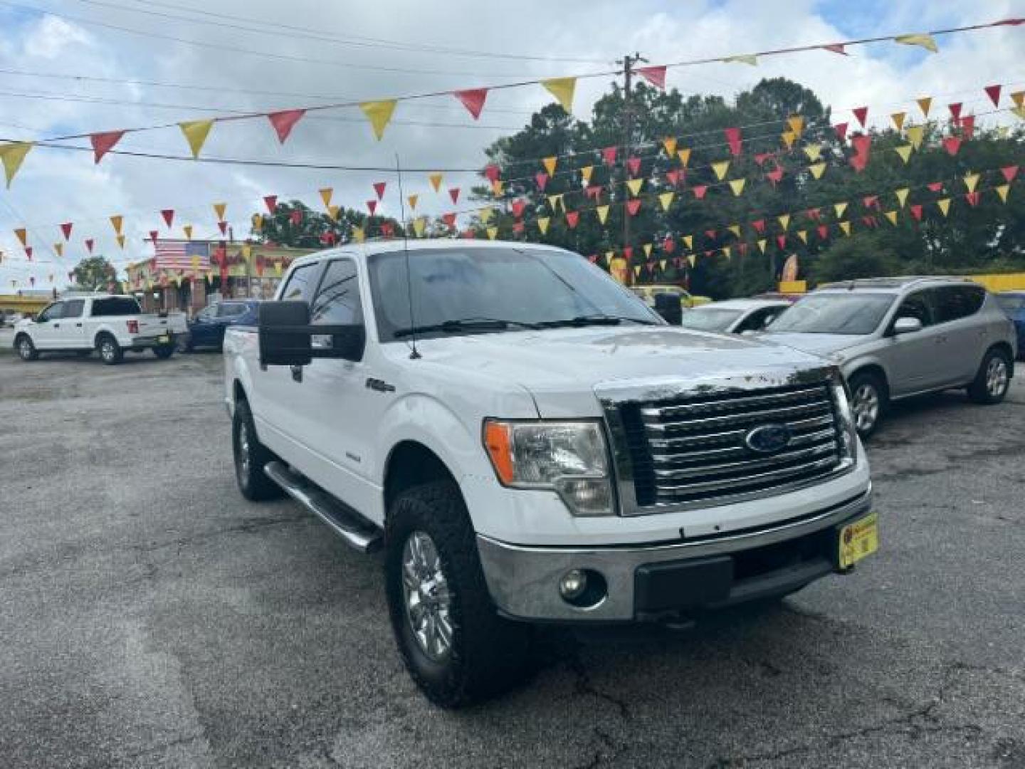 2011 White Ford F-150 XLT SuperCrew 5.5-ft (1FTFW1ET1BF) with an 3.5L V6 TURBO engine, 6-Speed Automatic transmission, located at 1806 Veterans Memorial Hwy SW, Austell, GA, 30168, (770) 944-9558, 33.817959, -84.606987 - Photo#2