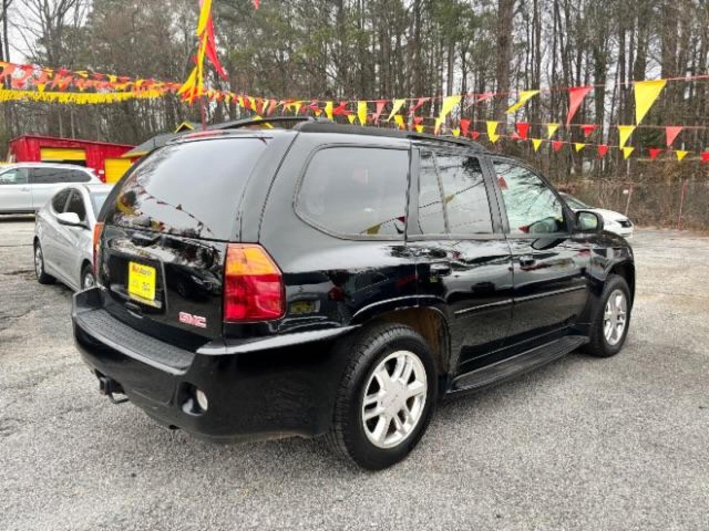 2006 Black GMC Envoy Denali 4WD (1GKET63M862) with an 5.3L V8 OHV 16V engine, 4-Speed Automatic transmission, located at 1806 Veterans Memorial Hwy SW, Austell, GA, 30168, (770) 944-9558, 33.817959, -84.606987 - Photo#0