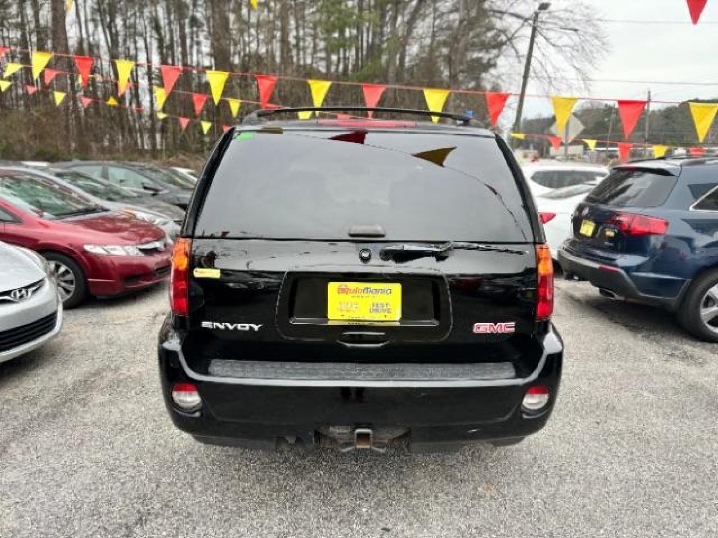 2006 Black GMC Envoy Denali 4WD (1GKET63M862) with an 5.3L V8 OHV 16V engine, 4-Speed Automatic transmission, located at 1806 Veterans Memorial Hwy SW, Austell, GA, 30168, (770) 944-9558, 33.817959, -84.606987 - Photo#2