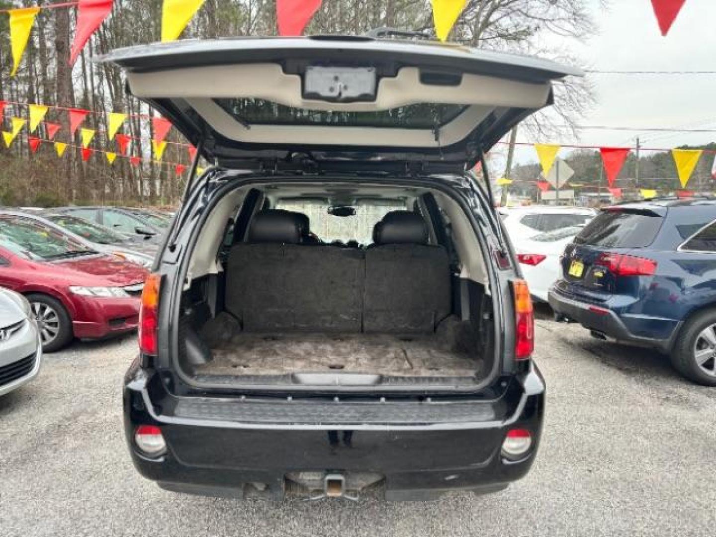 2006 Black GMC Envoy Denali 4WD (1GKET63M862) with an 5.3L V8 OHV 16V engine, 4-Speed Automatic transmission, located at 1806 Veterans Memorial Hwy SW, Austell, GA, 30168, (770) 944-9558, 33.817959, -84.606987 - Photo#3