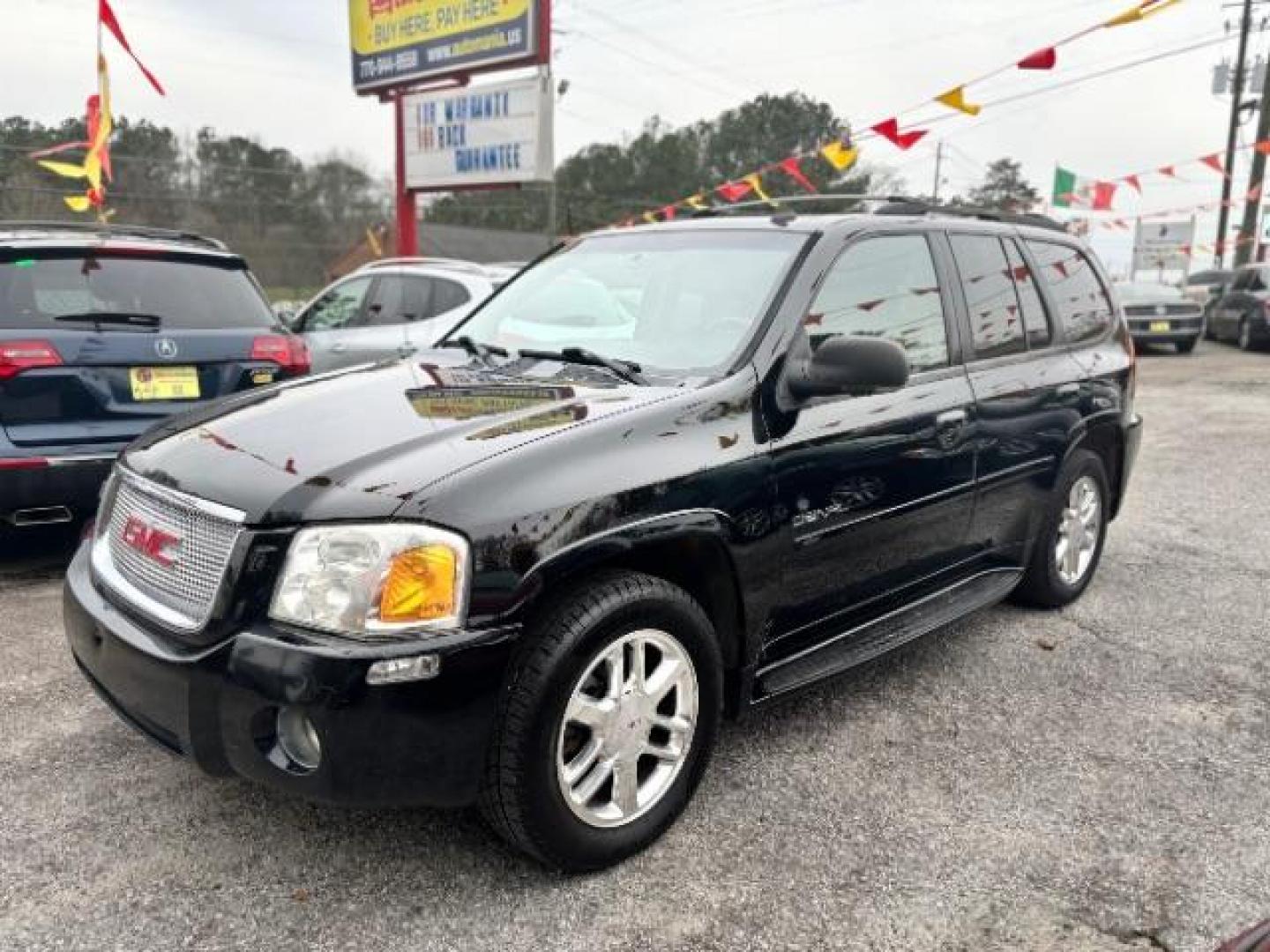 2006 Black GMC Envoy Denali 4WD (1GKET63M862) with an 5.3L V8 OHV 16V engine, 4-Speed Automatic transmission, located at 1806 Veterans Memorial Hwy SW, Austell, GA, 30168, (770) 944-9558, 33.817959, -84.606987 - Photo#5