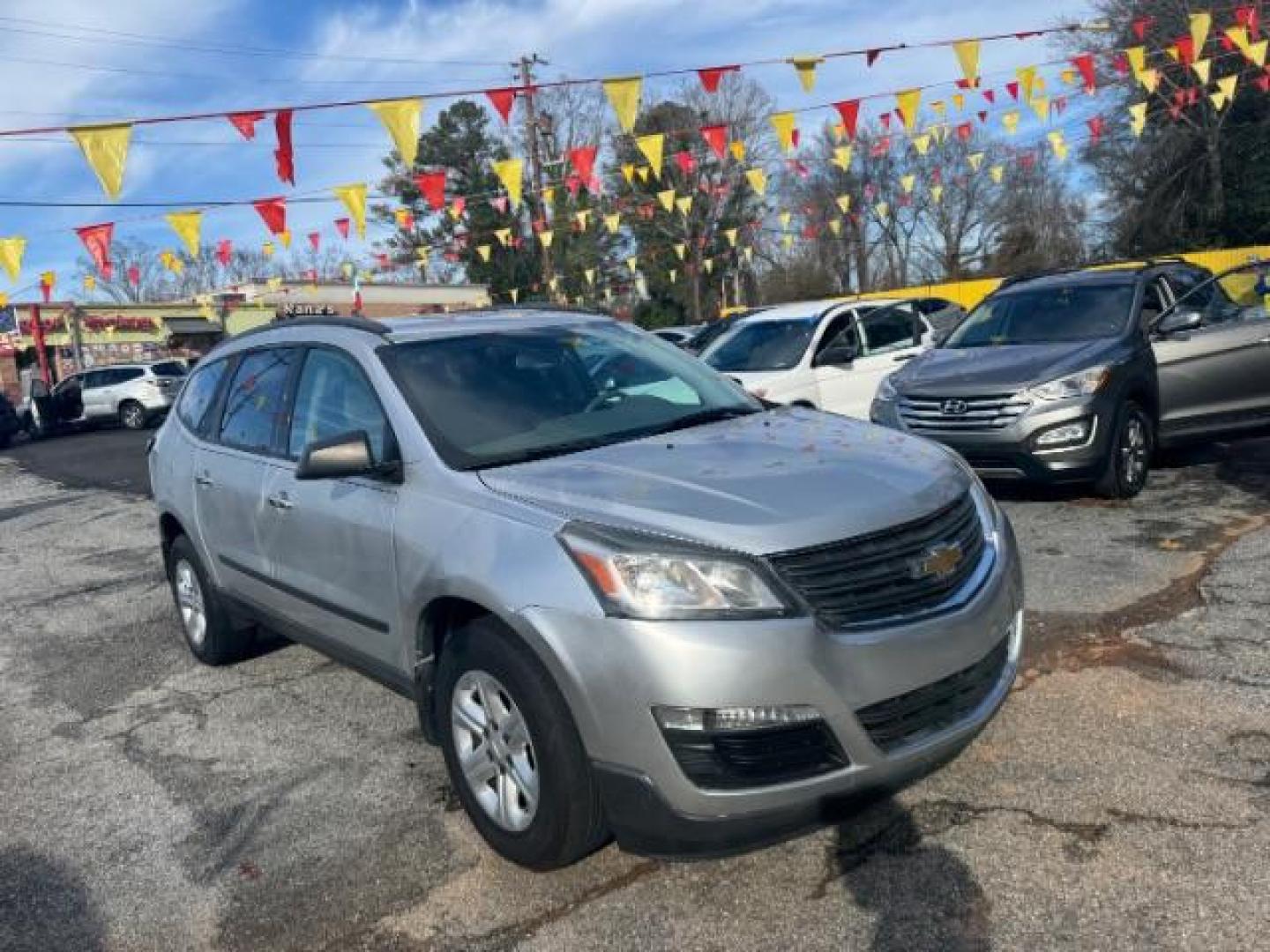 2015 Silver Chevrolet Traverse LS FWD w/PDC (1GNKRFED0FJ) with an 3.6L V6 DOHC 24V engine, 6-Speed Automatic transmission, located at 1806 Veterans Memorial Hwy SW, Austell, GA, 30168, (770) 944-9558, 33.817959, -84.606987 - Photo#2