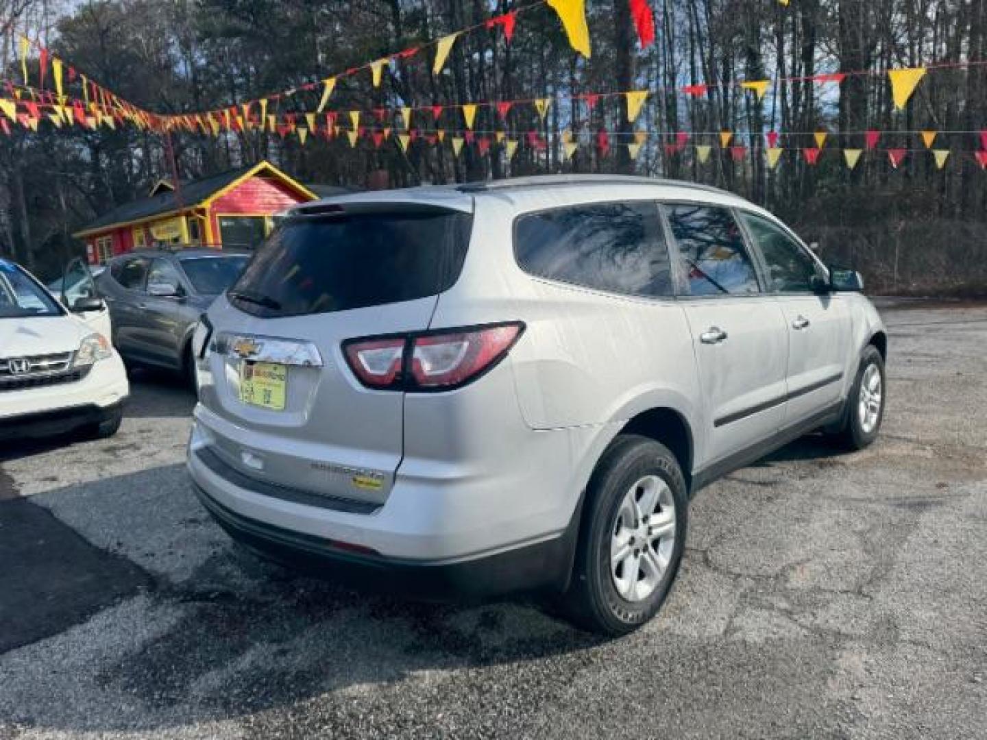 2015 Silver Chevrolet Traverse LS FWD w/PDC (1GNKRFED0FJ) with an 3.6L V6 DOHC 24V engine, 6-Speed Automatic transmission, located at 1806 Veterans Memorial Hwy SW, Austell, GA, 30168, (770) 944-9558, 33.817959, -84.606987 - Photo#3