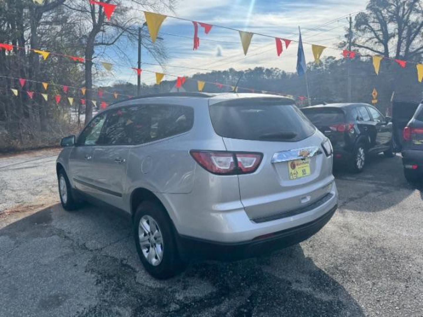 2015 Silver Chevrolet Traverse LS FWD w/PDC (1GNKRFED0FJ) with an 3.6L V6 DOHC 24V engine, 6-Speed Automatic transmission, located at 1806 Veterans Memorial Hwy SW, Austell, GA, 30168, (770) 944-9558, 33.817959, -84.606987 - Photo#5