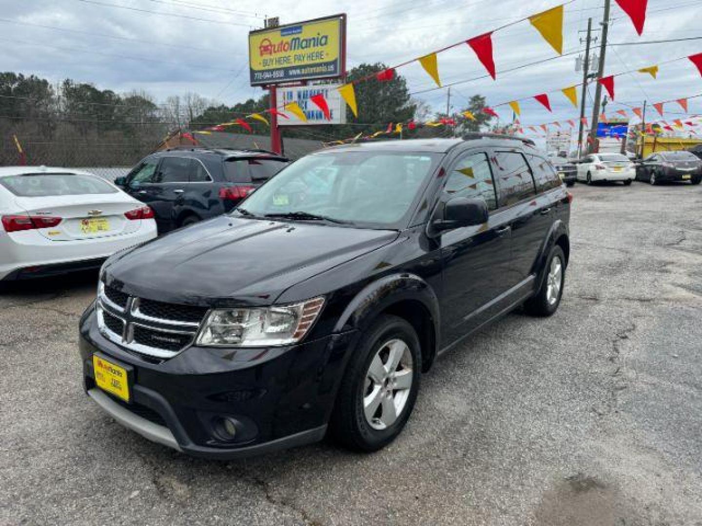 2012 Black Dodge Journey SXT (3C4PDCBG1CT) with an 3.6L V6 DOHC 24V engine, 6-Speed Automatic transmission, located at 1806 Veterans Memorial Hwy SW, Austell, GA, 30168, (770) 944-9558, 33.817959, -84.606987 - Photo#0