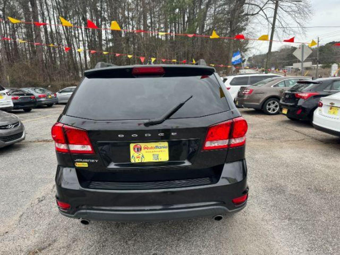 2012 Black Dodge Journey SXT (3C4PDCBG1CT) with an 3.6L V6 DOHC 24V engine, 6-Speed Automatic transmission, located at 1806 Veterans Memorial Hwy SW, Austell, GA, 30168, (770) 944-9558, 33.817959, -84.606987 - Photo#3