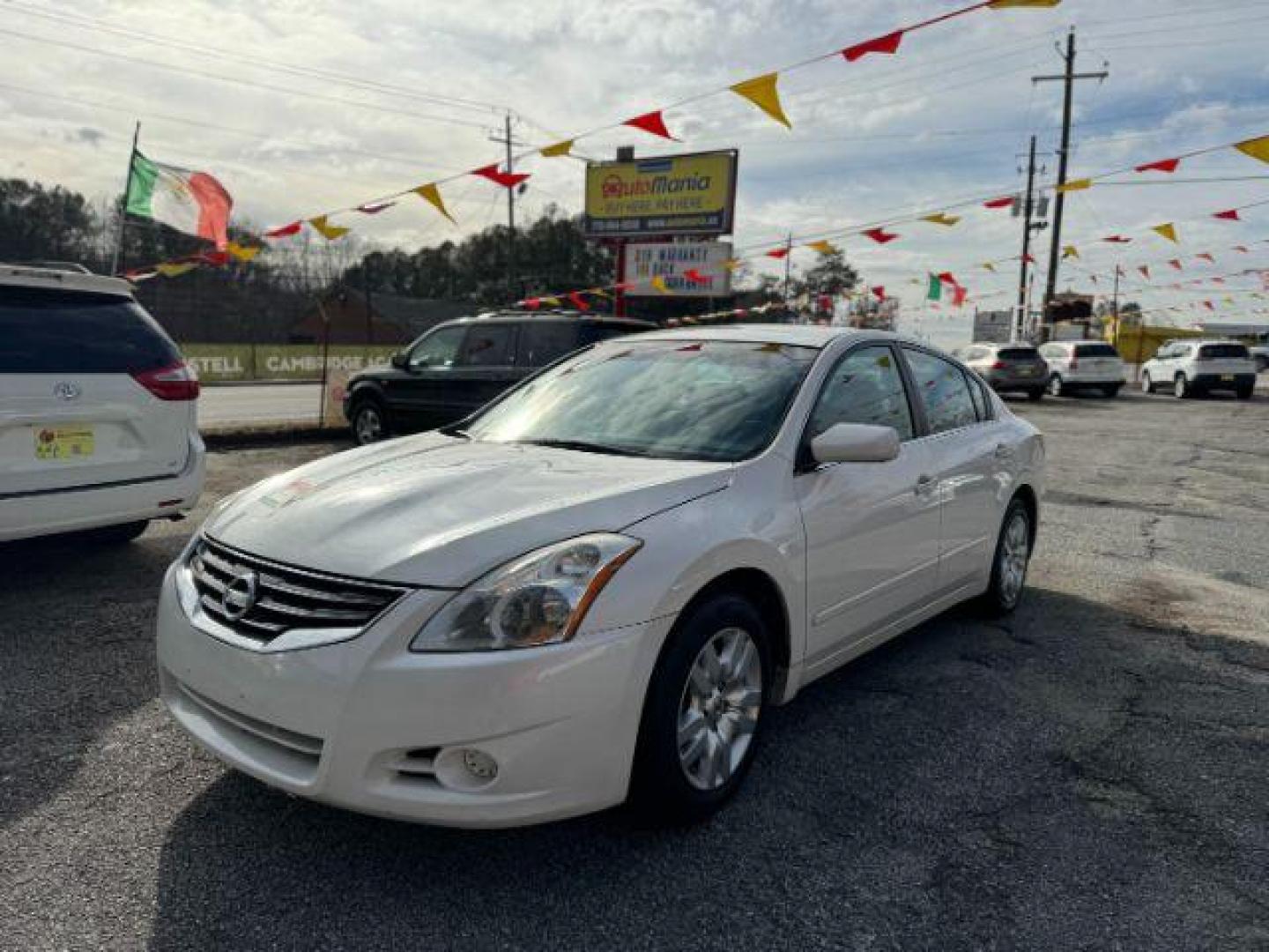 2012 White Nissan Altima 2.5 (1N4AL2APXCC) with an 2.5L L4 DOHC 16V engine, 6-Speed Manual transmission, located at 1806 Veterans Memorial Hwy SW, Austell, GA, 30168, (770) 944-9558, 33.817959, -84.606987 - Photo#0