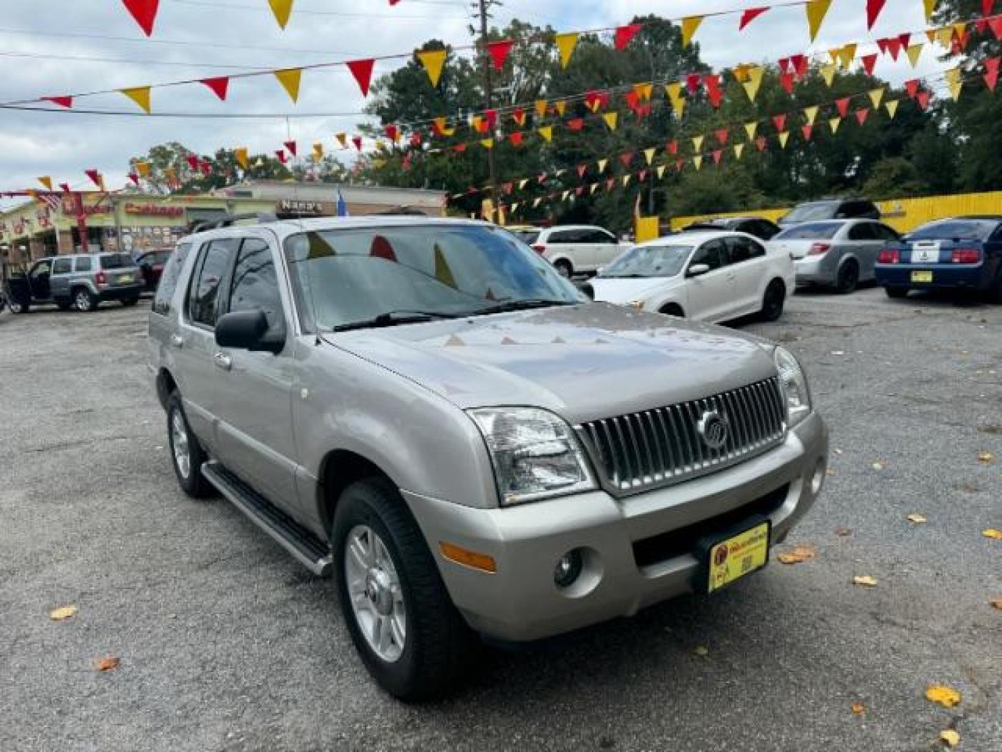 2003 Silver Mercury Mountaineer Convenience 4.6L AWD (4M2ZU86W73Z) with an 4.6L V8 SOHC 12V engine, 5-Speed Automatic transmission, located at 1806 Veterans Memorial Hwy SW, Austell, GA, 30168, (770) 944-9558, 33.817959, -84.606987 - Photo#2