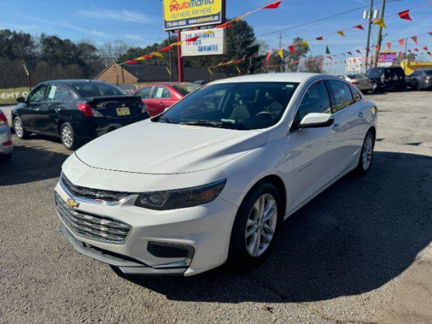 2017 White Chevrolet Malibu 1LT (1G1ZE5ST7HF) with an 1.5L L4 DOHC 16V engine, 6-Speed Automatic transmission, located at 1806 Veterans Memorial Hwy SW, Austell, GA, 30168, (770) 944-9558, 33.817959, -84.606987 - Photo#0