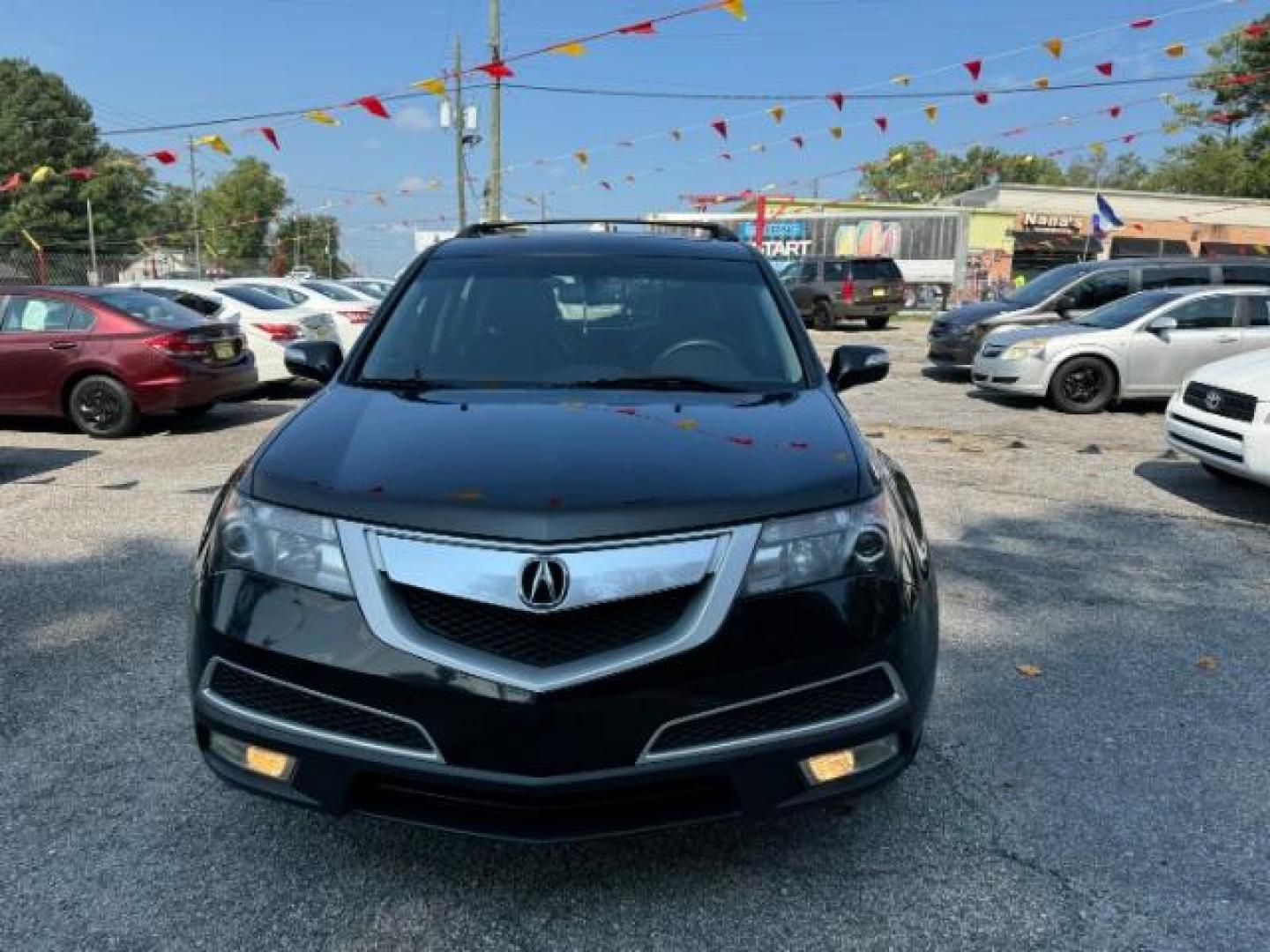 2011 Black Acura MDX 6-Spd AT (2HNYD2H22BH) with an 3.7L V6 SOHC 24V engine, 6-Speed Automatic transmission, located at 1806 Veterans Memorial Hwy SW, Austell, GA, 30168, (770) 944-9558, 33.817959, -84.606987 - Photo#1