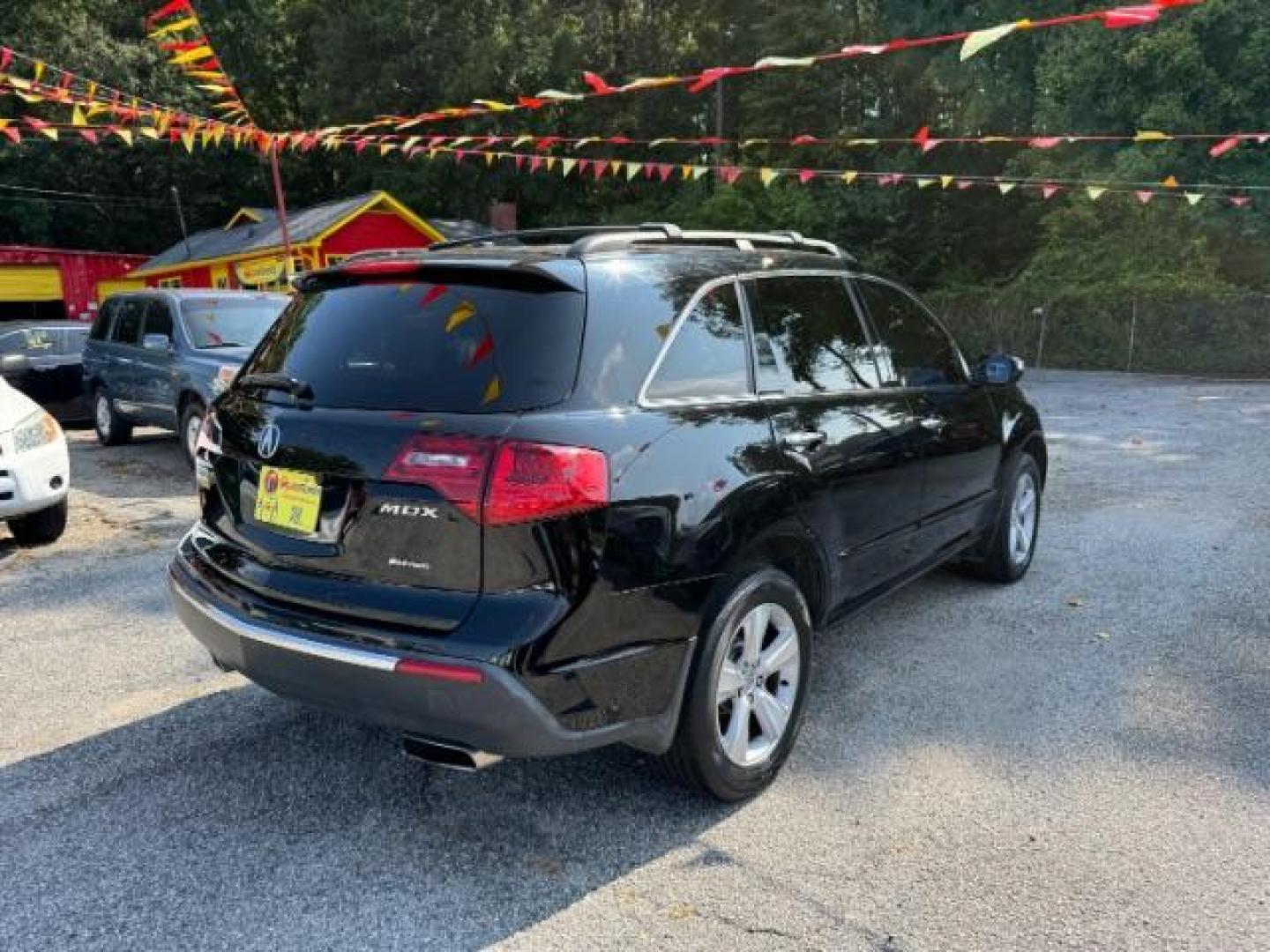 2011 Black Acura MDX 6-Spd AT (2HNYD2H22BH) with an 3.7L V6 SOHC 24V engine, 6-Speed Automatic transmission, located at 1806 Veterans Memorial Hwy SW, Austell, GA, 30168, (770) 944-9558, 33.817959, -84.606987 - Photo#3