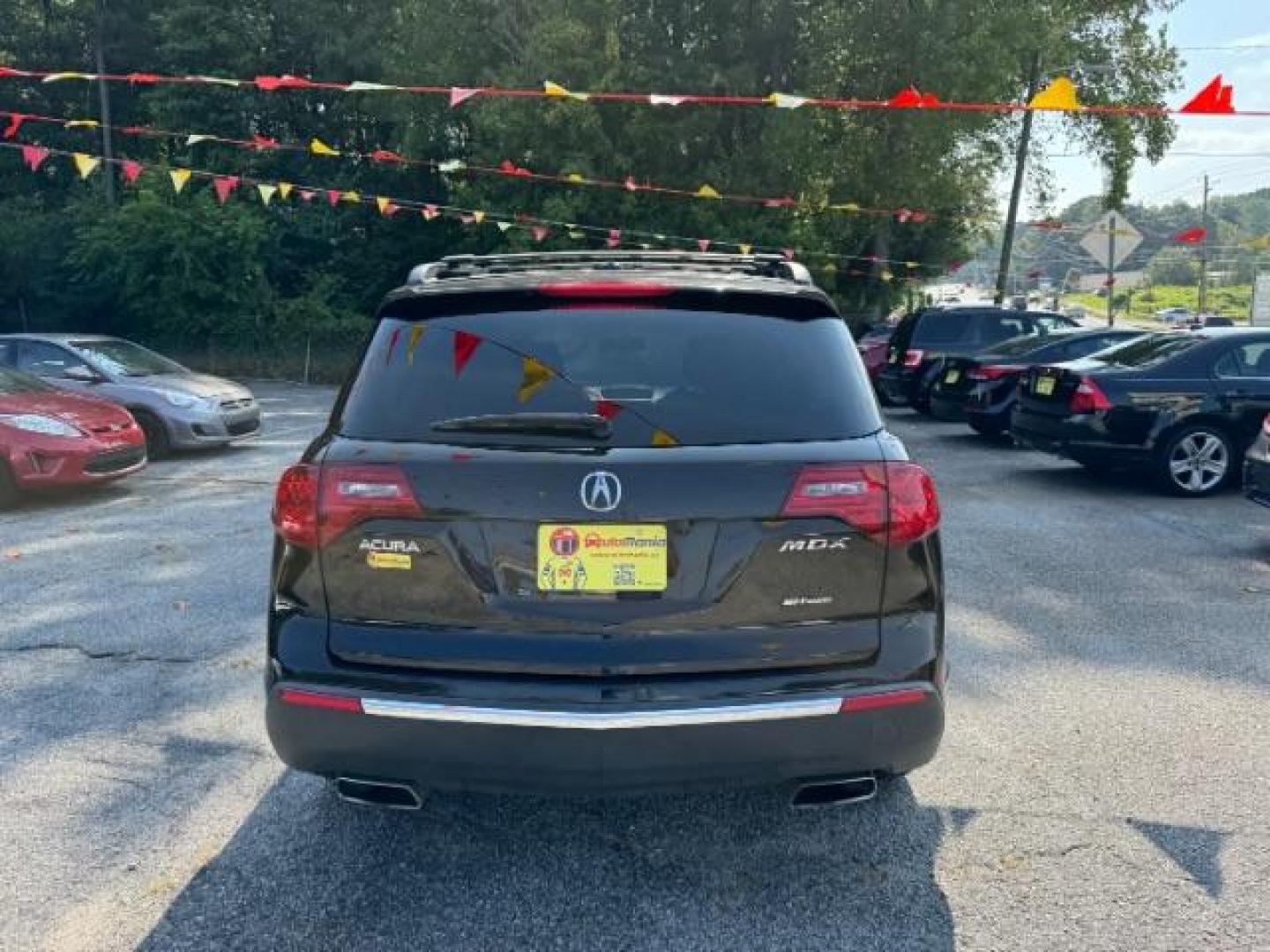 2011 Black Acura MDX 6-Spd AT (2HNYD2H22BH) with an 3.7L V6 SOHC 24V engine, 6-Speed Automatic transmission, located at 1806 Veterans Memorial Hwy SW, Austell, GA, 30168, (770) 944-9558, 33.817959, -84.606987 - Photo#4