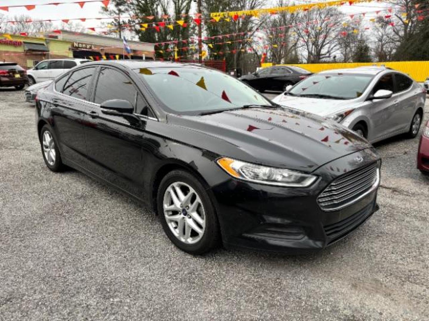 2015 Black Ford Fusion SE (3FA6P0H7XFR) with an 2.5L L4 DOHC 16V engine, 6-Speed Automatic transmission, located at 1806 Veterans Memorial Hwy SW, Austell, GA, 30168, (770) 944-9558, 33.817959, -84.606987 - Photo#0