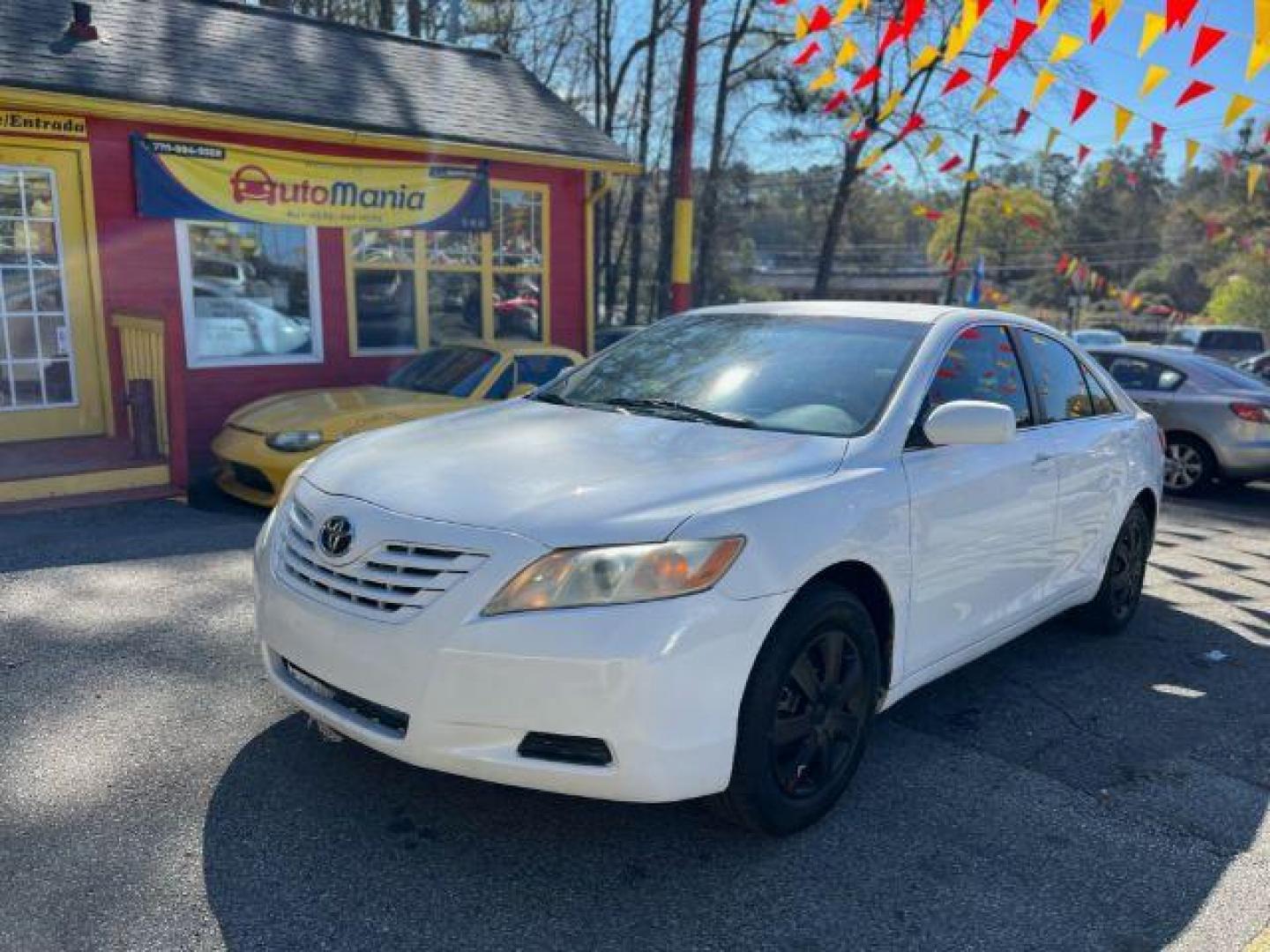 2007 White Toyota Camry LE 5-Spd AT (JTNBE46K773) with an 2.4L L4 DOHC 16V engine, 5-Speed Automatic transmission, located at 1806 Veterans Memorial Hwy SW, Austell, GA, 30168, (770) 944-9558, 33.817959, -84.606987 - Photo#0