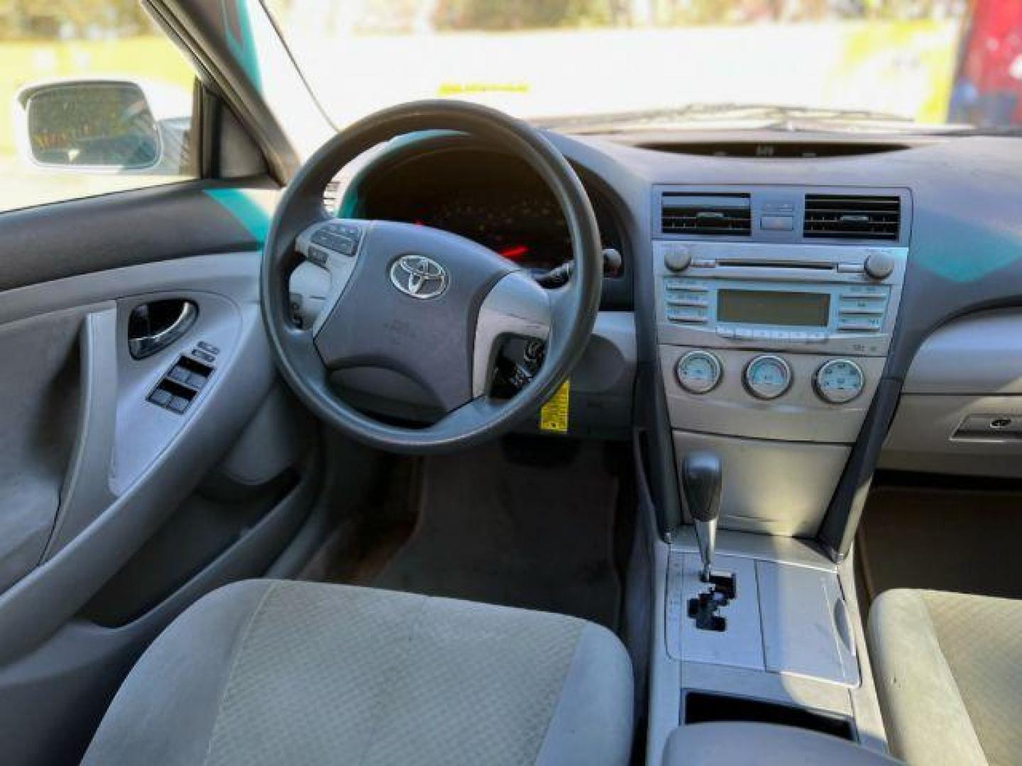 2007 White Toyota Camry LE 5-Spd AT (JTNBE46K773) with an 2.4L L4 DOHC 16V engine, 5-Speed Automatic transmission, located at 1806 Veterans Memorial Hwy SW, Austell, GA, 30168, (770) 944-9558, 33.817959, -84.606987 - Photo#12