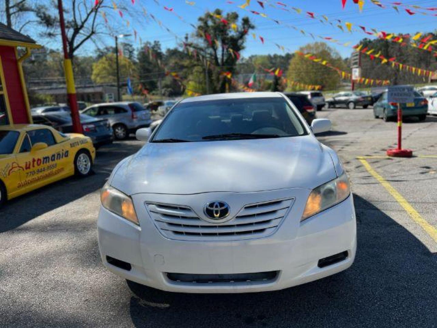 2007 White Toyota Camry LE 5-Spd AT (JTNBE46K773) with an 2.4L L4 DOHC 16V engine, 5-Speed Automatic transmission, located at 1806 Veterans Memorial Hwy SW, Austell, GA, 30168, (770) 944-9558, 33.817959, -84.606987 - Photo#1