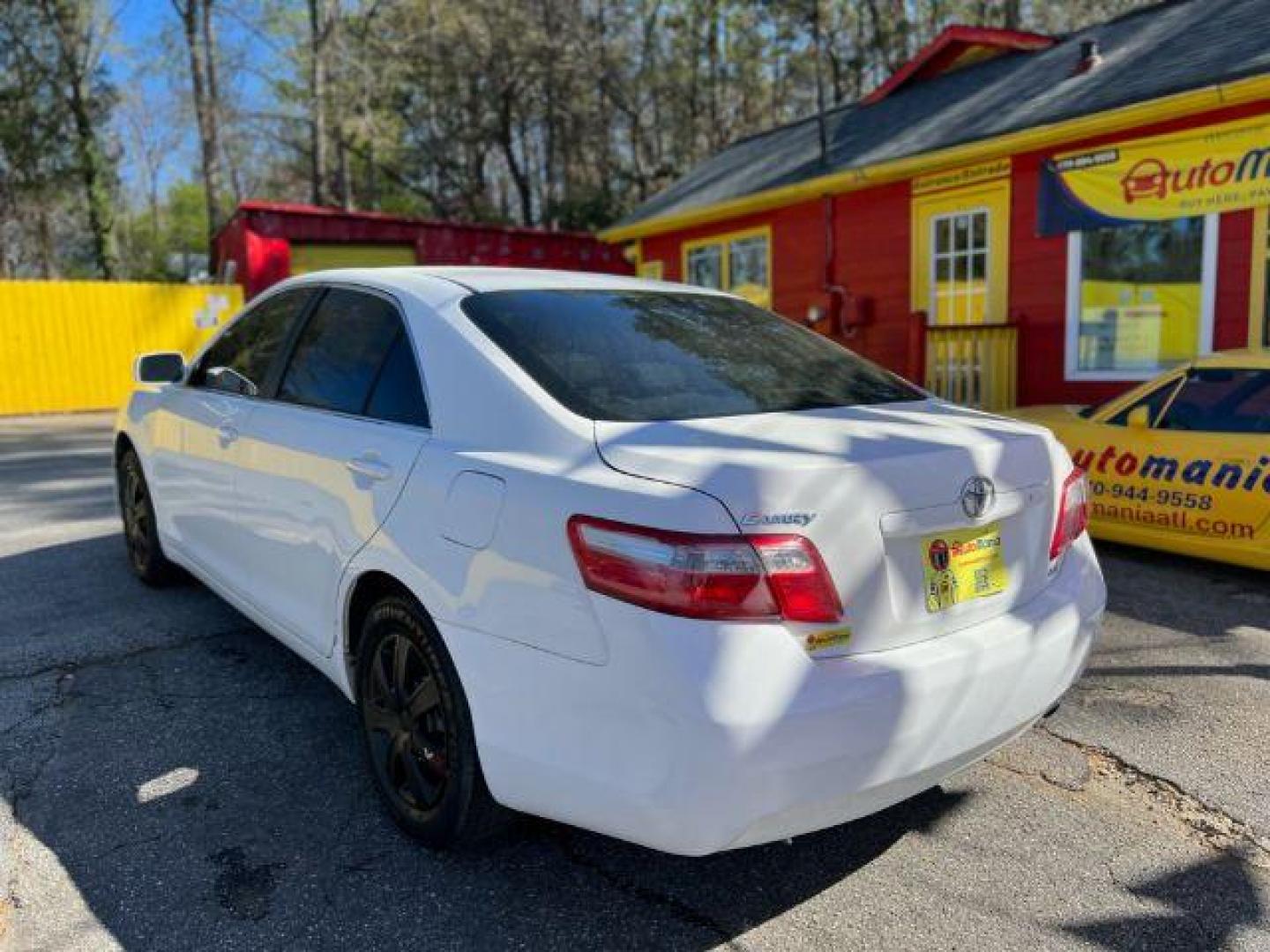 2007 White Toyota Camry LE 5-Spd AT (JTNBE46K773) with an 2.4L L4 DOHC 16V engine, 5-Speed Automatic transmission, located at 1806 Veterans Memorial Hwy SW, Austell, GA, 30168, (770) 944-9558, 33.817959, -84.606987 - Photo#5