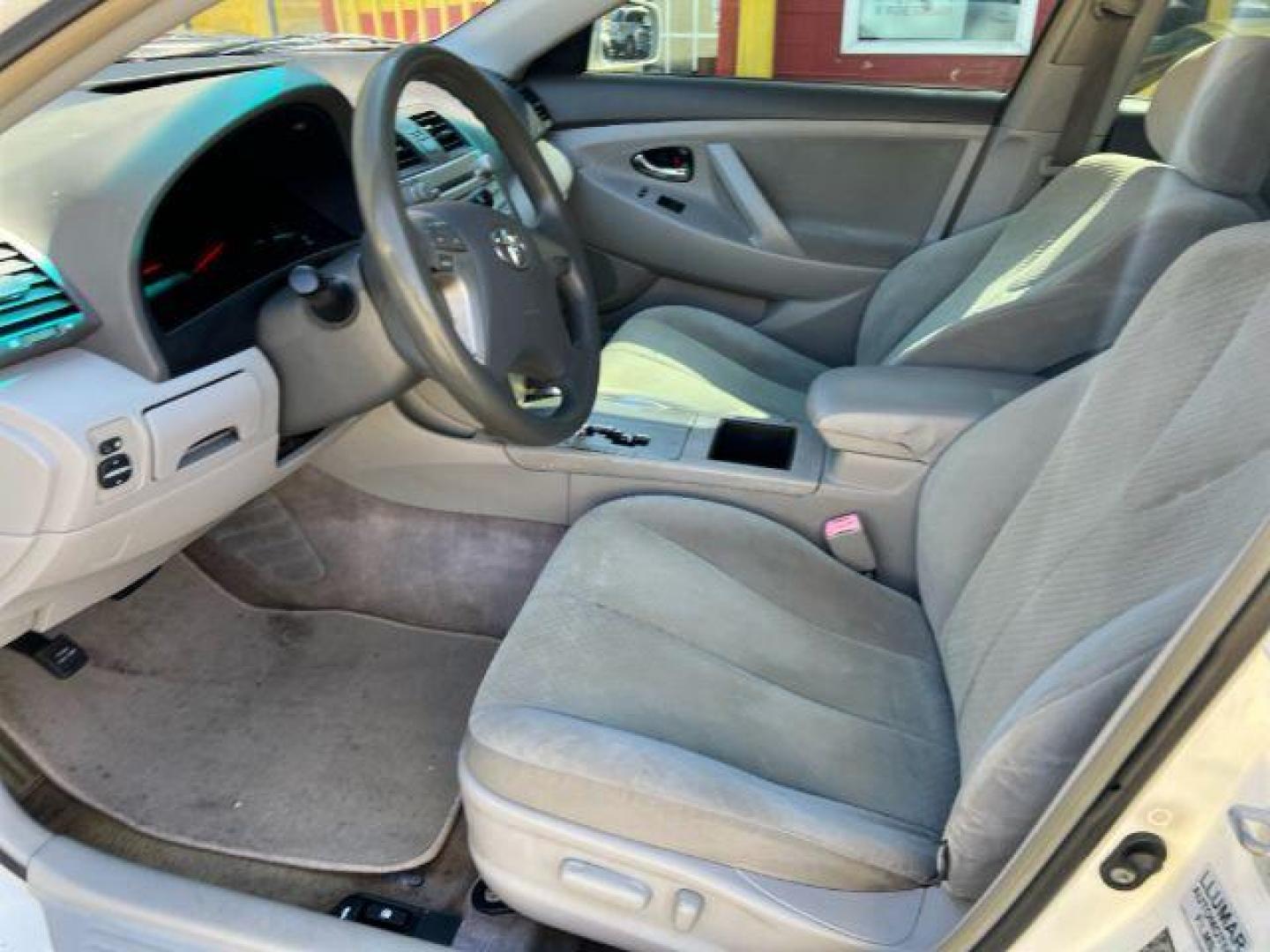 2007 White Toyota Camry LE 5-Spd AT (JTNBE46K773) with an 2.4L L4 DOHC 16V engine, 5-Speed Automatic transmission, located at 1806 Veterans Memorial Hwy SW, Austell, GA, 30168, (770) 944-9558, 33.817959, -84.606987 - Photo#6