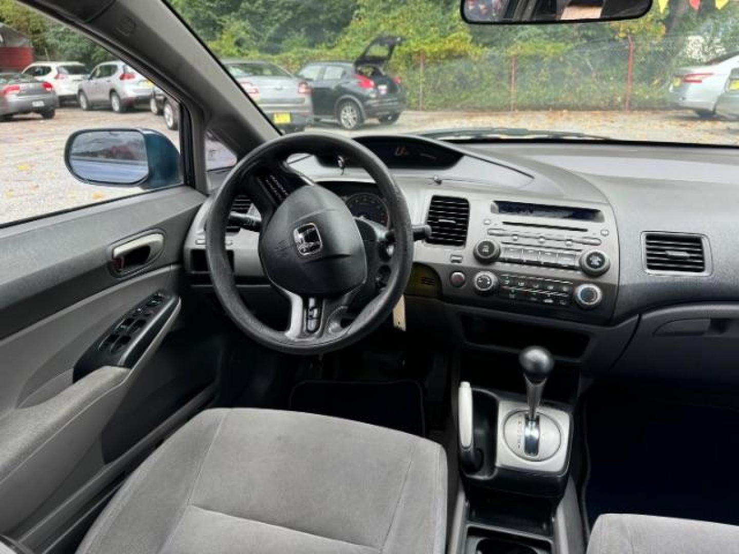 2007 Blue Honda Civic LX Sedan AT (1HGFA16527L) with an 1.8L L4 SOHC 16V engine, 5-Speed Automatic transmission, located at 1806 Veterans Memorial Hwy SW, Austell, GA, 30168, (770) 944-9558, 33.817959, -84.606987 - Photo#12