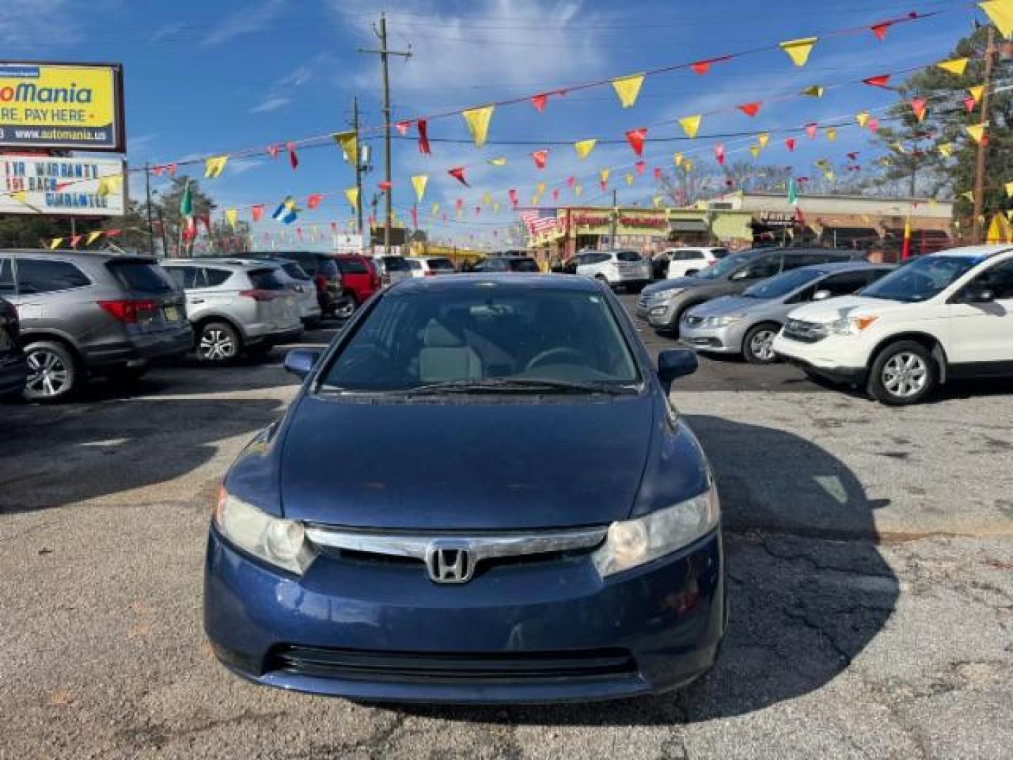 2007 Blue Honda Civic LX Sedan AT (1HGFA16527L) with an 1.8L L4 SOHC 16V engine, 5-Speed Automatic transmission, located at 1806 Veterans Memorial Hwy SW, Austell, GA, 30168, (770) 944-9558, 33.817959, -84.606987 - Photo#1