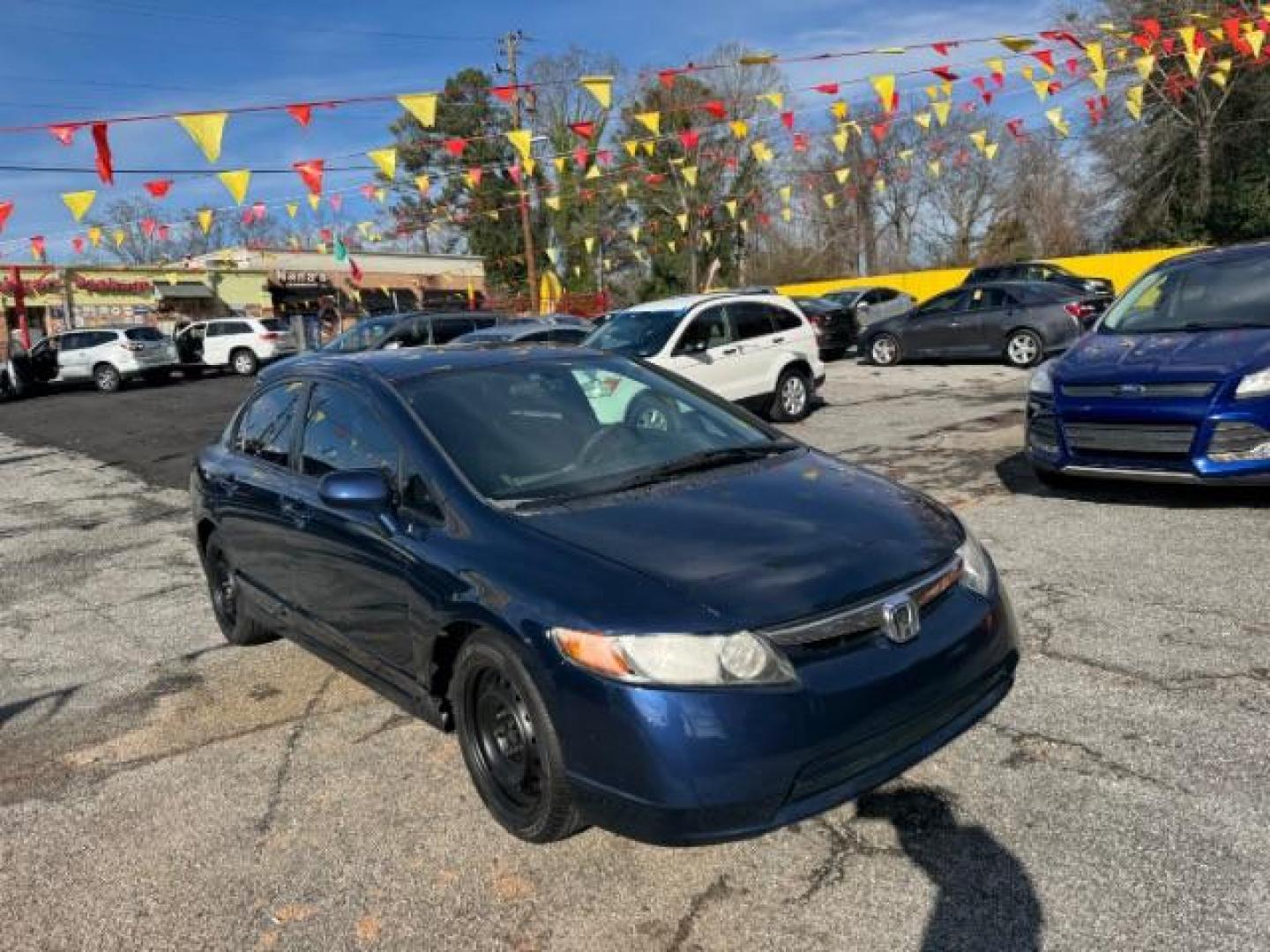 2007 Blue Honda Civic LX Sedan AT (1HGFA16527L) with an 1.8L L4 SOHC 16V engine, 5-Speed Automatic transmission, located at 1806 Veterans Memorial Hwy SW, Austell, GA, 30168, (770) 944-9558, 33.817959, -84.606987 - Photo#2