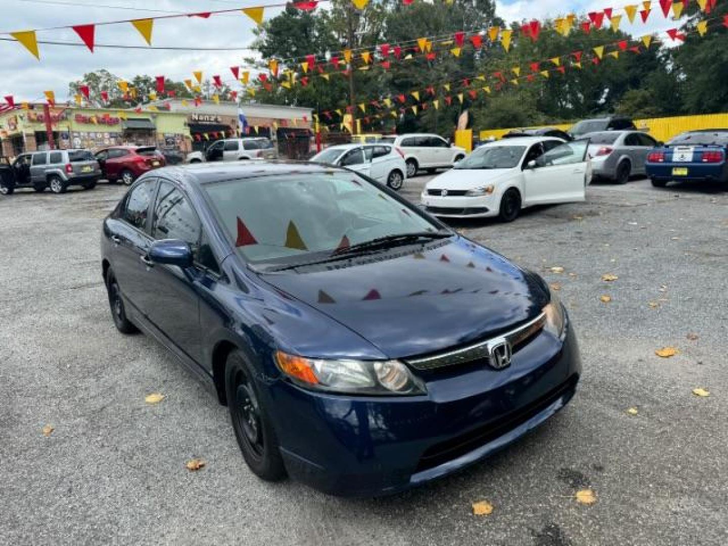 2007 Blue Honda Civic LX Sedan AT (1HGFA16527L) with an 1.8L L4 SOHC 16V engine, 5-Speed Automatic transmission, located at 1806 Veterans Memorial Hwy SW, Austell, GA, 30168, (770) 944-9558, 33.817959, -84.606987 - Photo#1