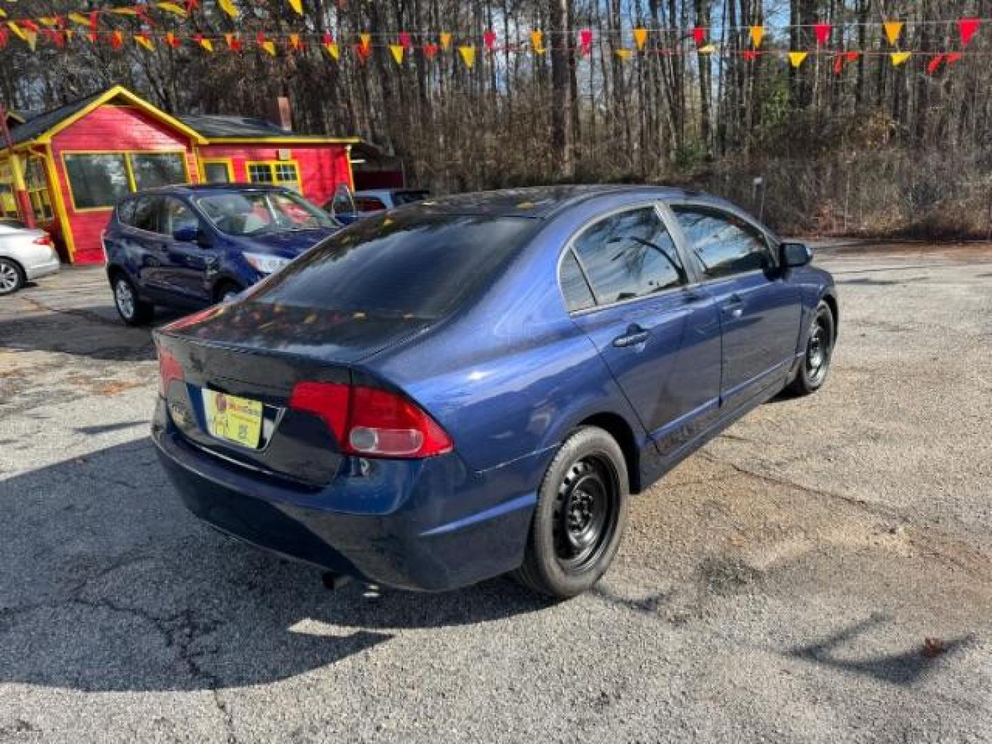 2007 Blue Honda Civic LX Sedan AT (1HGFA16527L) with an 1.8L L4 SOHC 16V engine, 5-Speed Automatic transmission, located at 1806 Veterans Memorial Hwy SW, Austell, GA, 30168, (770) 944-9558, 33.817959, -84.606987 - Photo#3