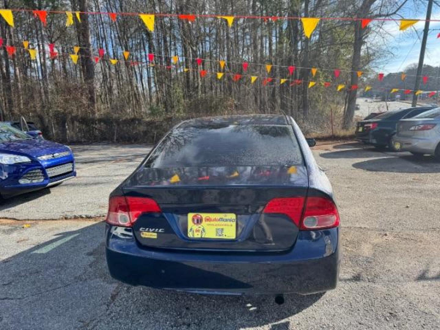 2007 Blue Honda Civic LX Sedan AT (1HGFA16527L) with an 1.8L L4 SOHC 16V engine, 5-Speed Automatic transmission, located at 1806 Veterans Memorial Hwy SW, Austell, GA, 30168, (770) 944-9558, 33.817959, -84.606987 - Photo#4