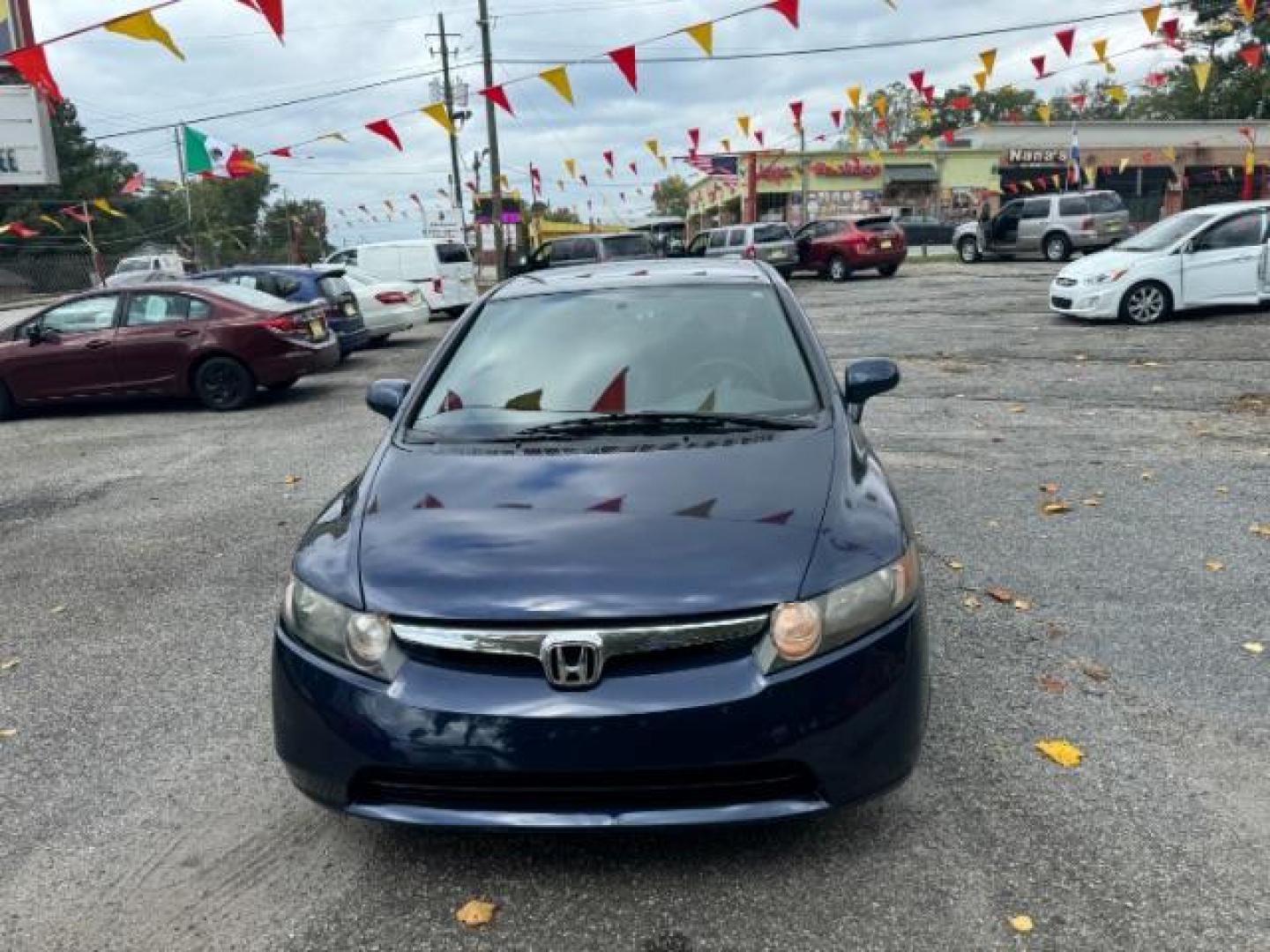 2007 Blue Honda Civic LX Sedan AT (1HGFA16527L) with an 1.8L L4 SOHC 16V engine, 5-Speed Automatic transmission, located at 1806 Veterans Memorial Hwy SW, Austell, GA, 30168, (770) 944-9558, 33.817959, -84.606987 - Photo#2