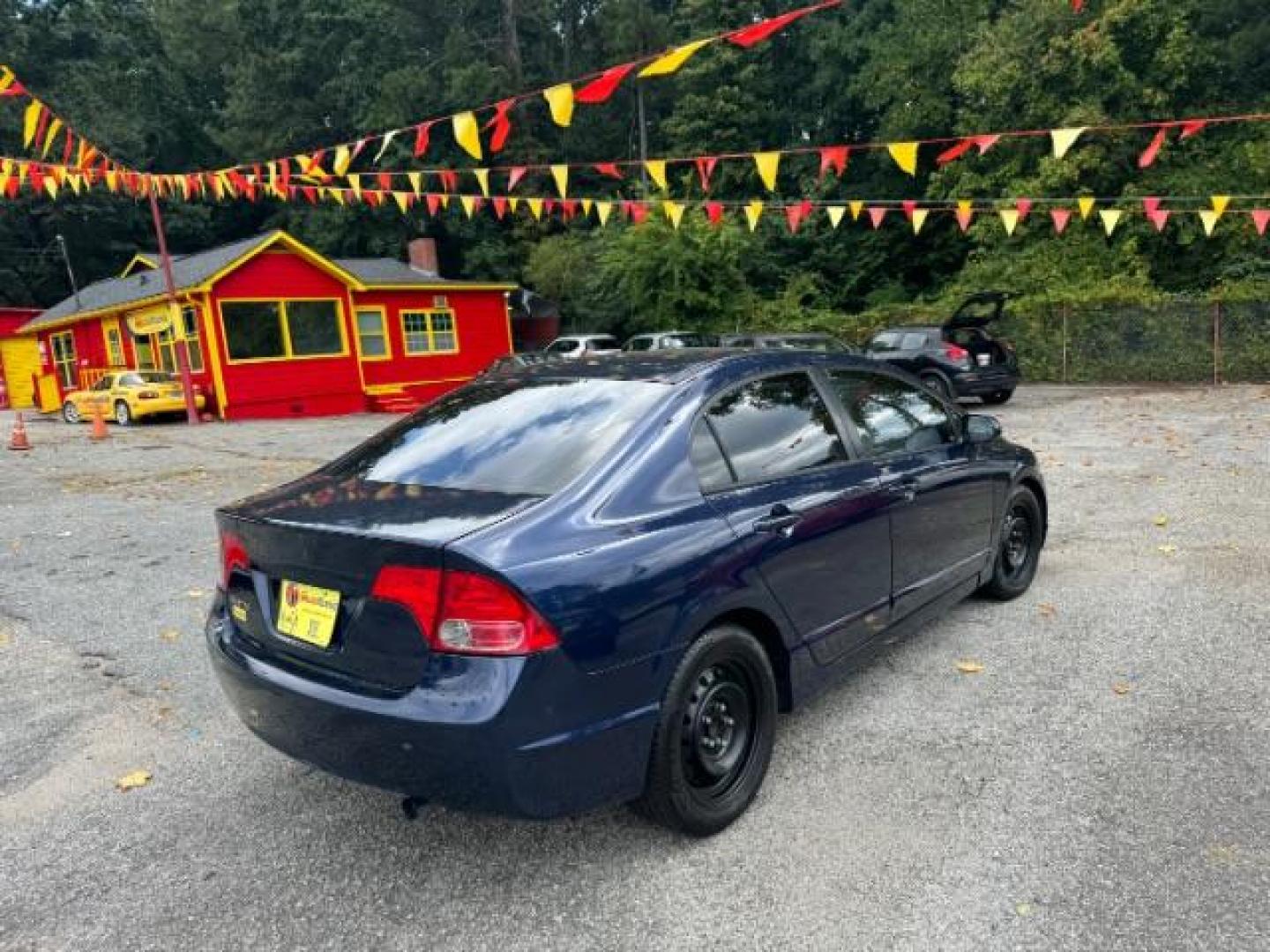 2007 Blue Honda Civic LX Sedan AT (1HGFA16527L) with an 1.8L L4 SOHC 16V engine, 5-Speed Automatic transmission, located at 1806 Veterans Memorial Hwy SW, Austell, GA, 30168, (770) 944-9558, 33.817959, -84.606987 - Photo#3