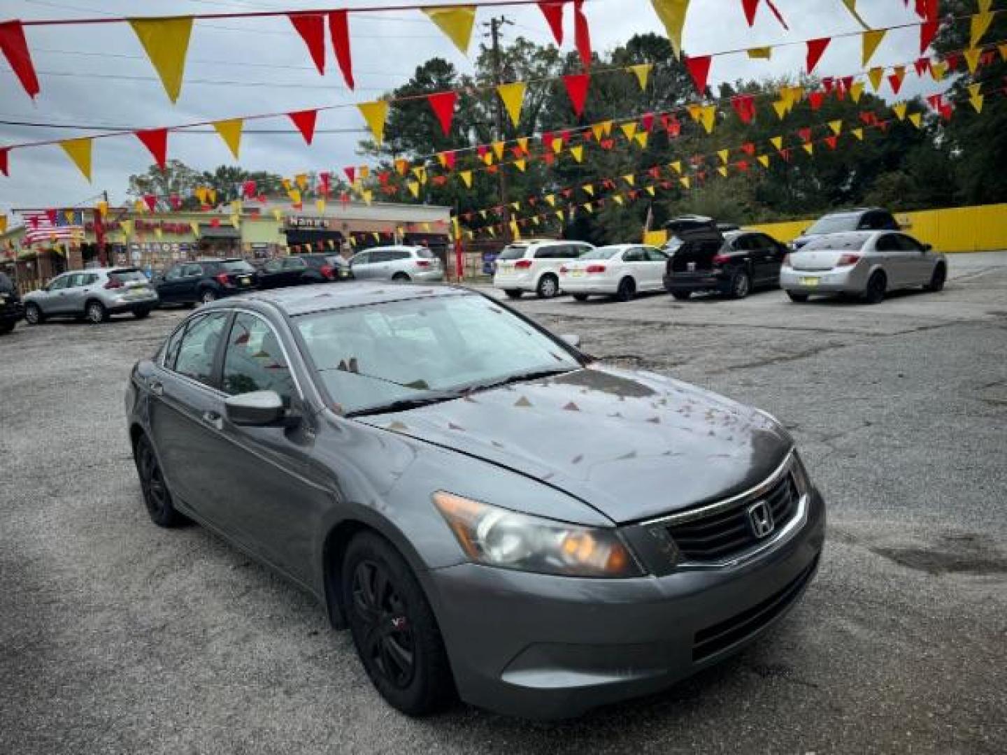 2009 Gray Honda Accord LX Sedan AT (1HGCP26329A) with an 2.4L L4 DOHC 16V engine, 5-Speed Automatic transmission, located at 1806 Veterans Memorial Hwy SW, Austell, GA, 30168, (770) 944-9558, 33.817959, -84.606987 - Photo#1